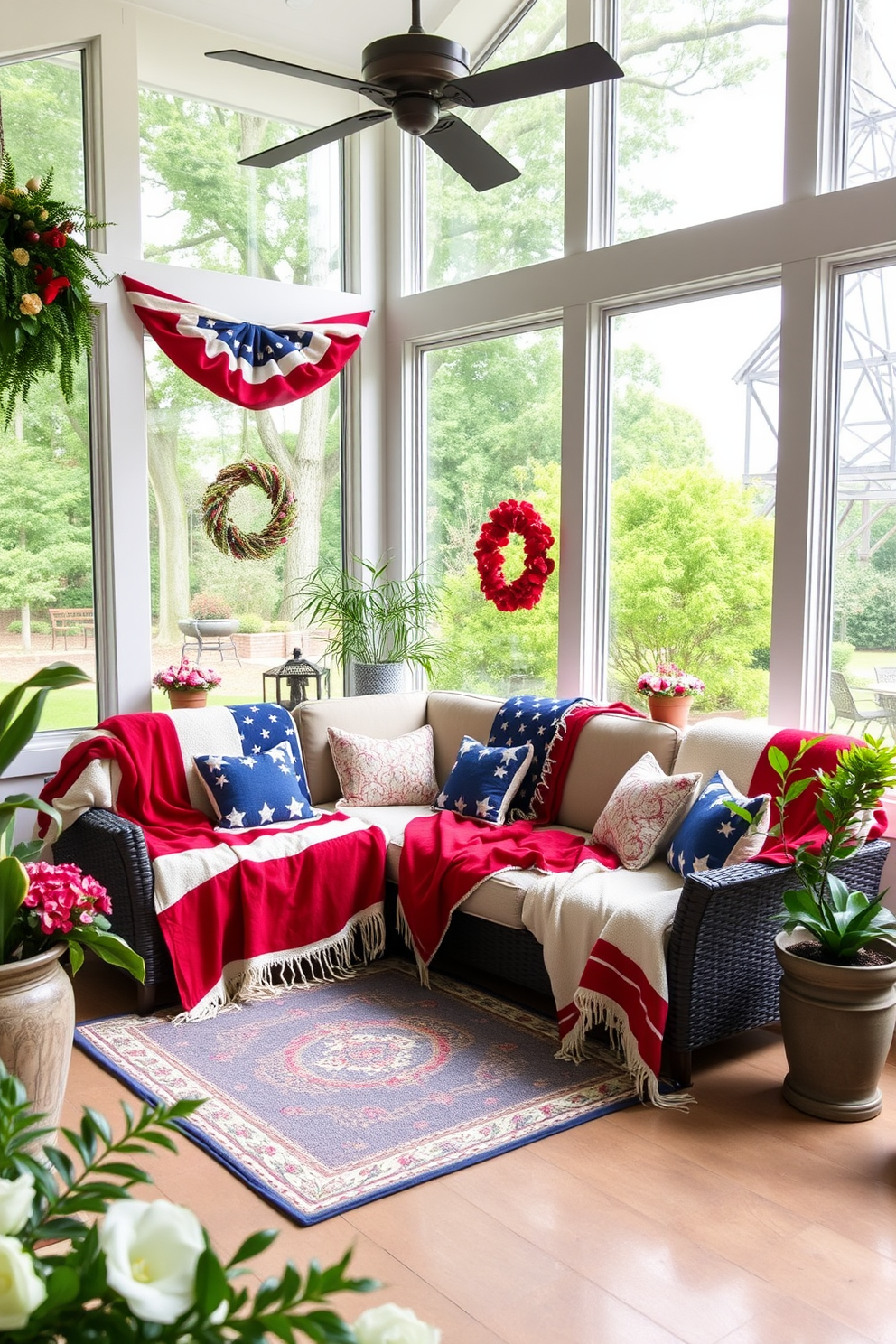 A cozy sunroom adorned with throw blankets in patriotic colors. The space features large windows that let in natural light, creating a warm and inviting atmosphere. Plush red, white, and blue throw blankets are draped over a comfortable sectional sofa. Potted plants and seasonal decor enhance the festive ambiance, making it perfect for Memorial Day gatherings.