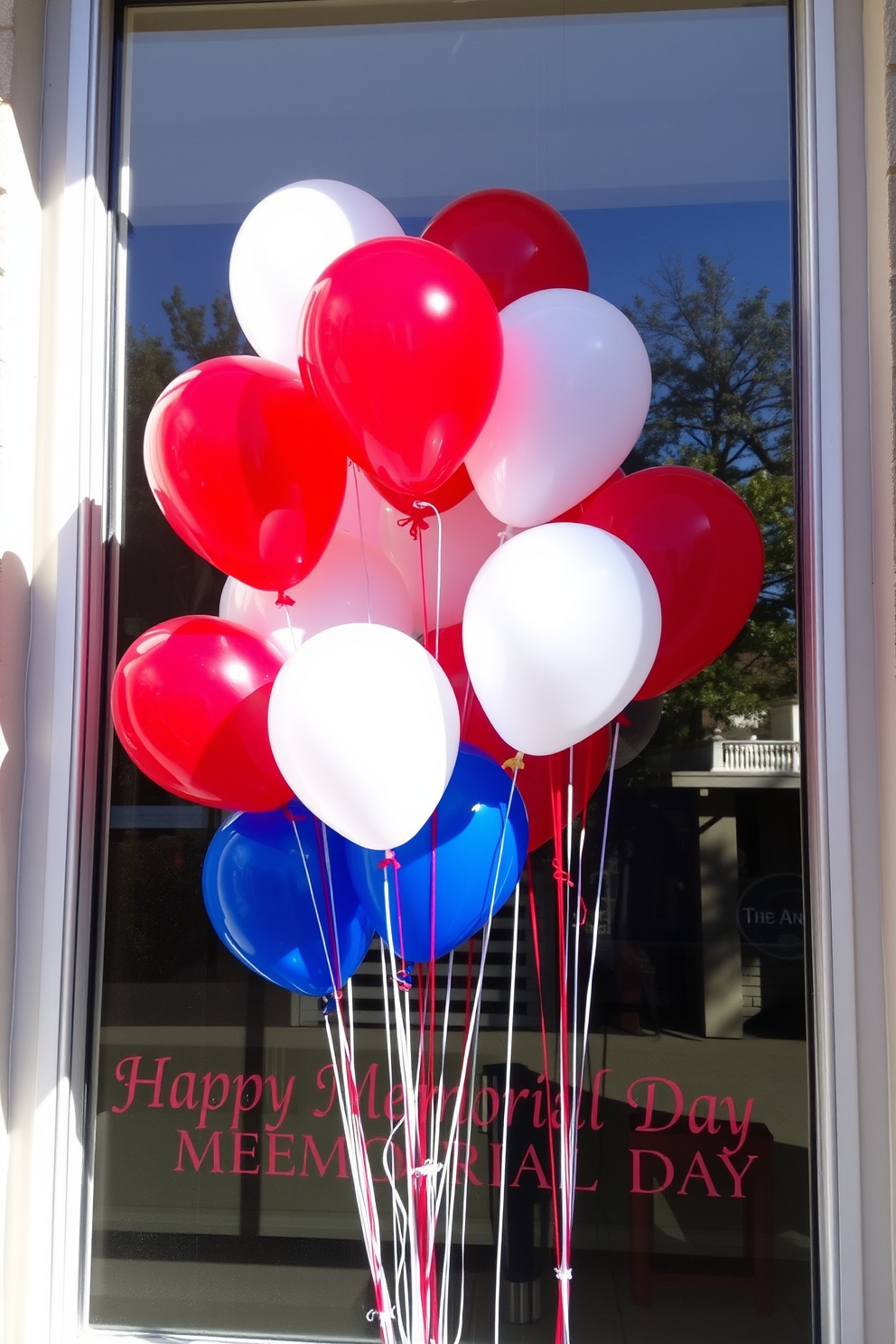 A festive window display celebrating Memorial Day. Red, white, and blue balloons are tied together and float gracefully against the backdrop of the window frame. The balloons are arranged in clusters, creating a vibrant and patriotic atmosphere. Sunlight filters through, illuminating the colors and enhancing the cheerful ambiance of the decor.