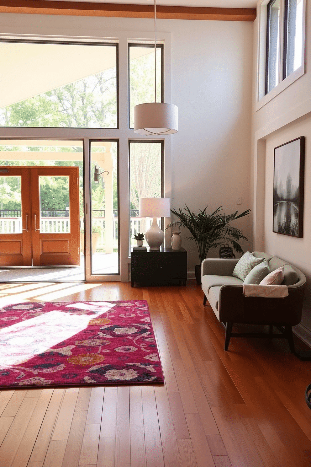 A spacious foyer bathed in natural light through expansive glass doors, welcoming guests with a warm and inviting atmosphere. The design features a sleek console table with a sculptural lamp, complemented by a vibrant area rug that adds a pop of color to the polished hardwood floor. Mid-Century Modern elements define the space, showcasing a mix of clean lines and organic shapes in the furniture. A statement pendant light hangs from the ceiling, casting a soft glow over the area, while potted plants bring a touch of nature indoors.