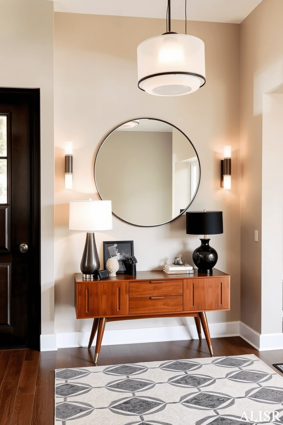 A stylish foyer featuring layered lighting that combines sleek sconces and elegant table lamps. The walls are painted in a soft beige, complemented by a geometric patterned rug that adds warmth and texture to the space. A striking Mid Century Modern console table sits against the wall, adorned with curated decor pieces and a statement lamp. Above the table, a large round mirror reflects the ambient light, enhancing the inviting atmosphere of the entrance.