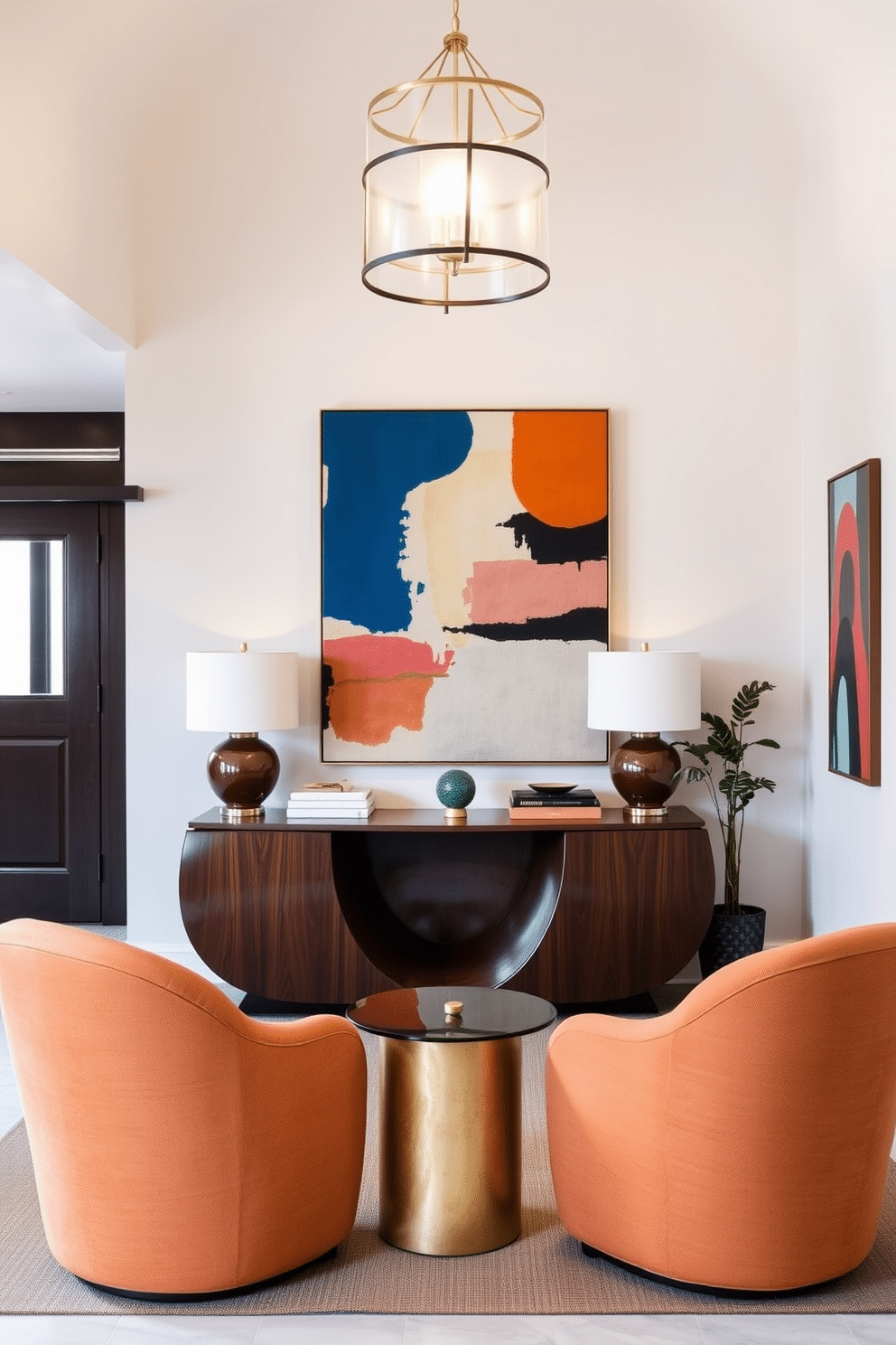 A welcoming foyer featuring curved furniture that emphasizes soft edges, creating a serene and inviting atmosphere. The focal point is a sculptural console table with smooth lines, complemented by a pair of plush, rounded armchairs upholstered in a warm, neutral fabric. The walls are adorned with abstract art that highlights the Mid Century Modern aesthetic, featuring bold colors and geometric shapes. A statement light fixture with a vintage flair hangs above, illuminating the space and enhancing the overall design.