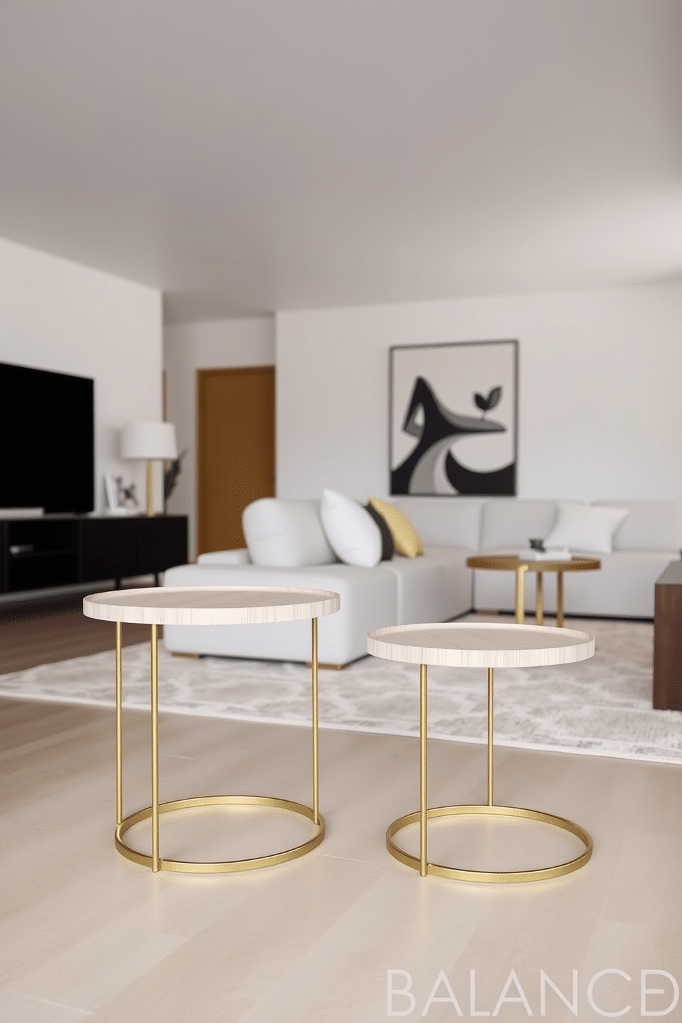 Simple, elegant side tables for balance. Each table features a sleek, round design with a light wood finish, complemented by a delicate metal base in brushed gold. Minimalist family room design ideas. The space is open and airy, with a neutral color palette, a low-profile sectional sofa, and a large area rug that anchors the seating area.