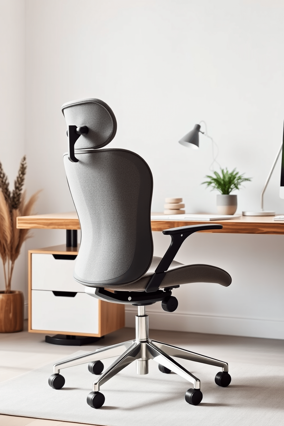 A sleek ergonomic chair designed for both comfort and style, featuring a modern silhouette and adjustable features. The chair is upholstered in a soft, breathable fabric, complemented by a polished metal base that adds a touch of elegance. A minimalist home office design that emphasizes clean lines and uncluttered spaces. The room showcases a simple wooden desk paired with a stylish task lamp, surrounded by subtle decorative elements that enhance productivity without overwhelming the senses.