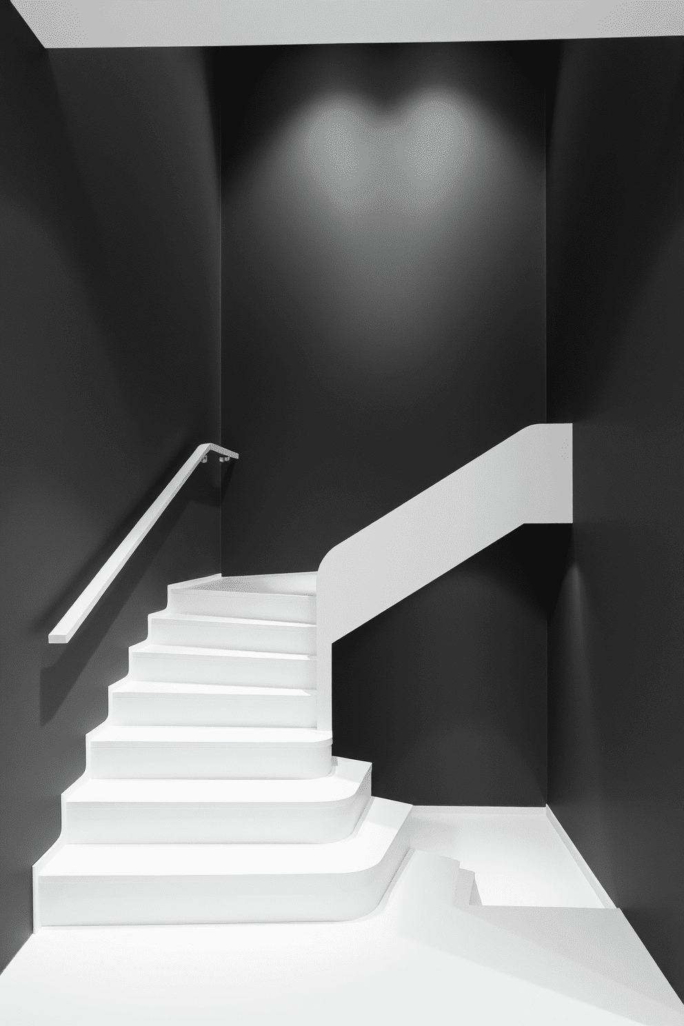 A sleek monochrome staircase ascends gracefully, featuring a smooth white railing and steps that blend seamlessly into the surrounding space. The walls are painted in a deep charcoal gray, creating a striking contrast that highlights the staircase's elegant lines. The minimalist design is accentuated by the absence of ornate decorations, allowing the simplicity of the form to shine. Soft, ambient lighting illuminates the staircase, enhancing the overall modern aesthetic and inviting one to ascend.