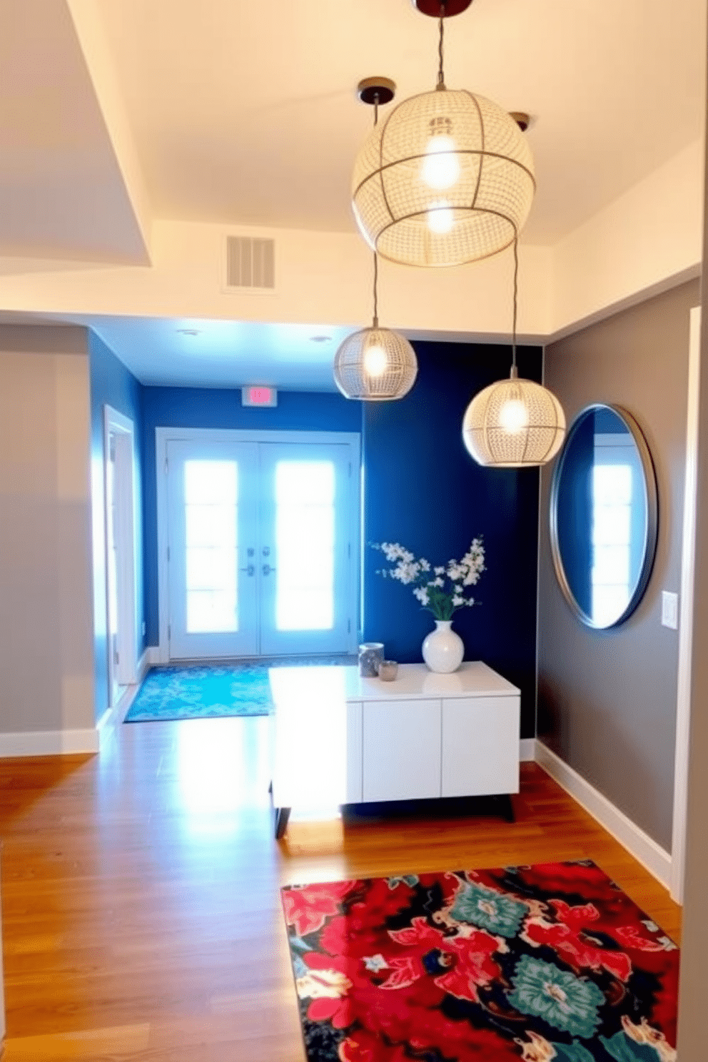 A modern entryway featuring bright, eye-catching lighting fixtures that create a warm and inviting atmosphere. The space is adorned with a sleek console table, complemented by a large round mirror that reflects the light beautifully. Stylish pendant lights hang from the ceiling, illuminating the area with a soft glow. A vibrant area rug adds a pop of color to the hardwood floor, enhancing the contemporary feel of the entryway.