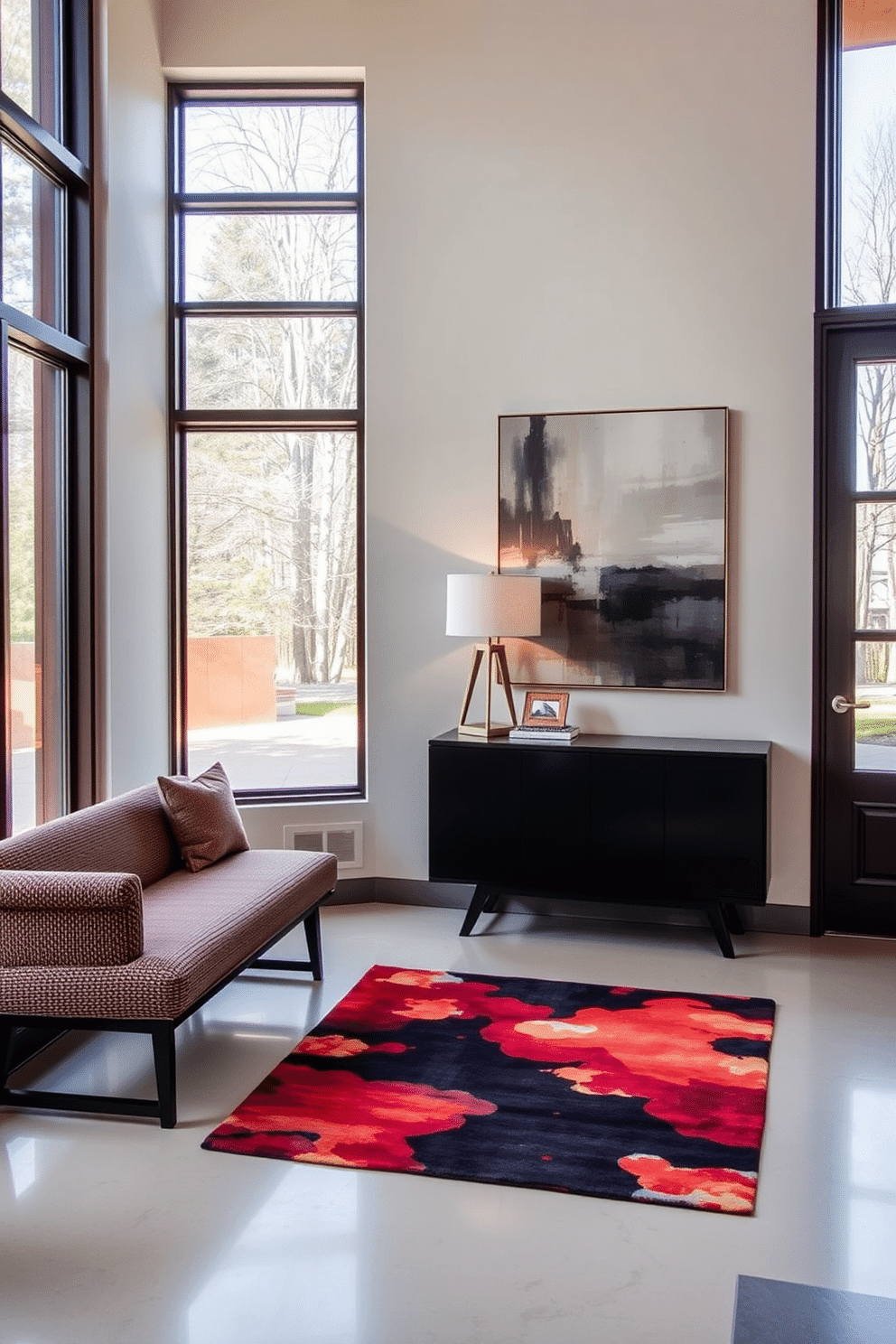 A contemporary foyer design that exudes sophistication. The space features a sleek console table with a geometric lamp, accompanied by a large abstract painting that serves as a focal point on the wall. To the left, a stylish bench upholstered in a rich fabric provides seating, while a vibrant area rug adds warmth to the floor. Large windows allow natural light to flood the area, highlighting the modern décor and creating an inviting atmosphere.