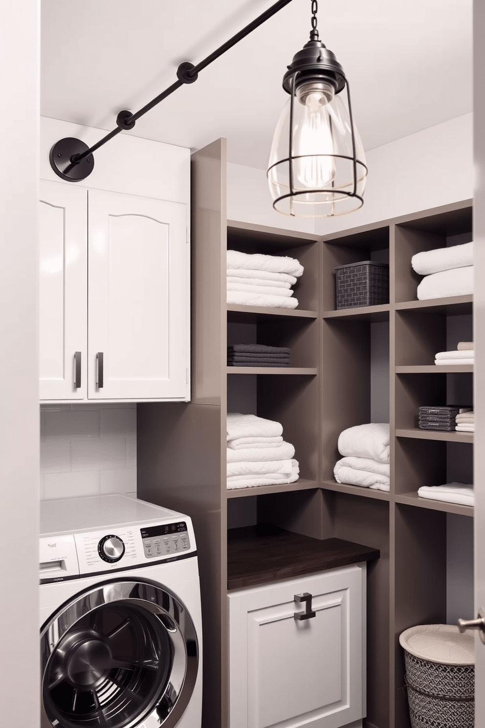 A modern laundry room featuring industrial-style lighting fixtures that add a touch of charm. The space includes sleek cabinetry with a mix of open shelving, showcasing neatly folded towels and laundry essentials.