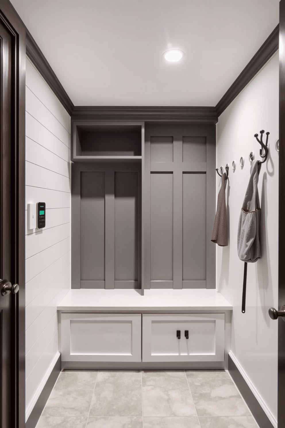 A modern mudroom featuring smart technology for convenience. The space includes a built-in bench with integrated charging ports, sleek storage cubbies, and a digital control panel for lighting and temperature. The walls are adorned with a combination of shiplap and painted finishes, while the flooring consists of durable, water-resistant tiles. Stylish hooks and a contemporary coat rack complete the look, ensuring functionality meets aesthetic appeal.