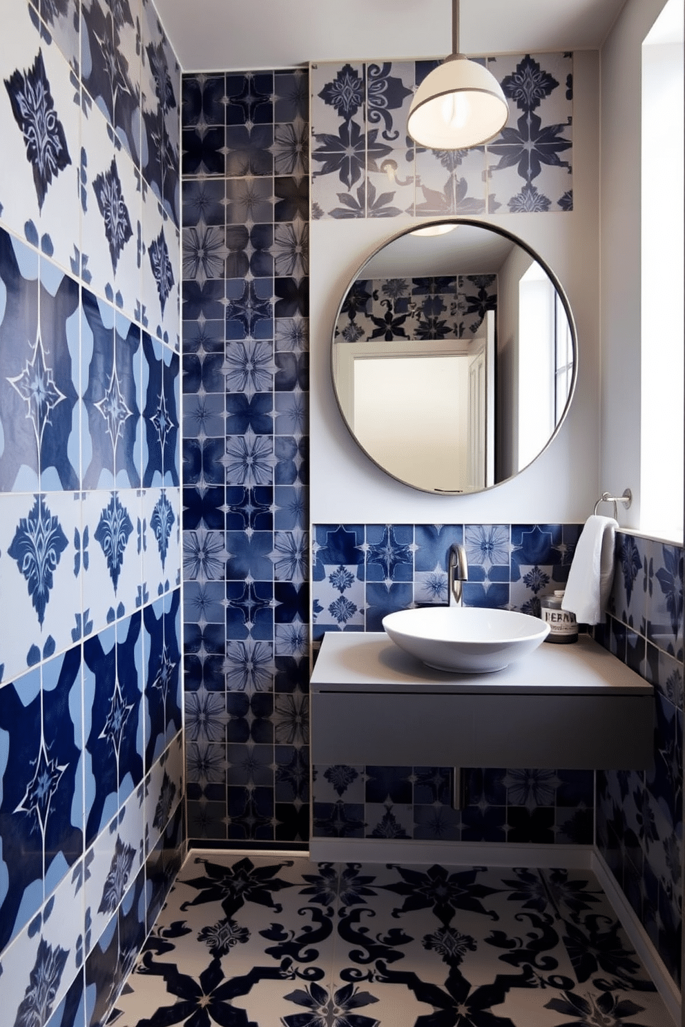 A modern powder room featuring artistic tile patterns that create a striking visual interest. The walls are adorned with bold, geometric tiles in a palette of deep blues and whites, complemented by a sleek, floating vanity with a vessel sink. The lighting is soft and ambient, highlighting the intricate designs of the tiles while providing a warm glow. A large, round mirror with a minimalist frame hangs above the vanity, enhancing the room's contemporary feel.