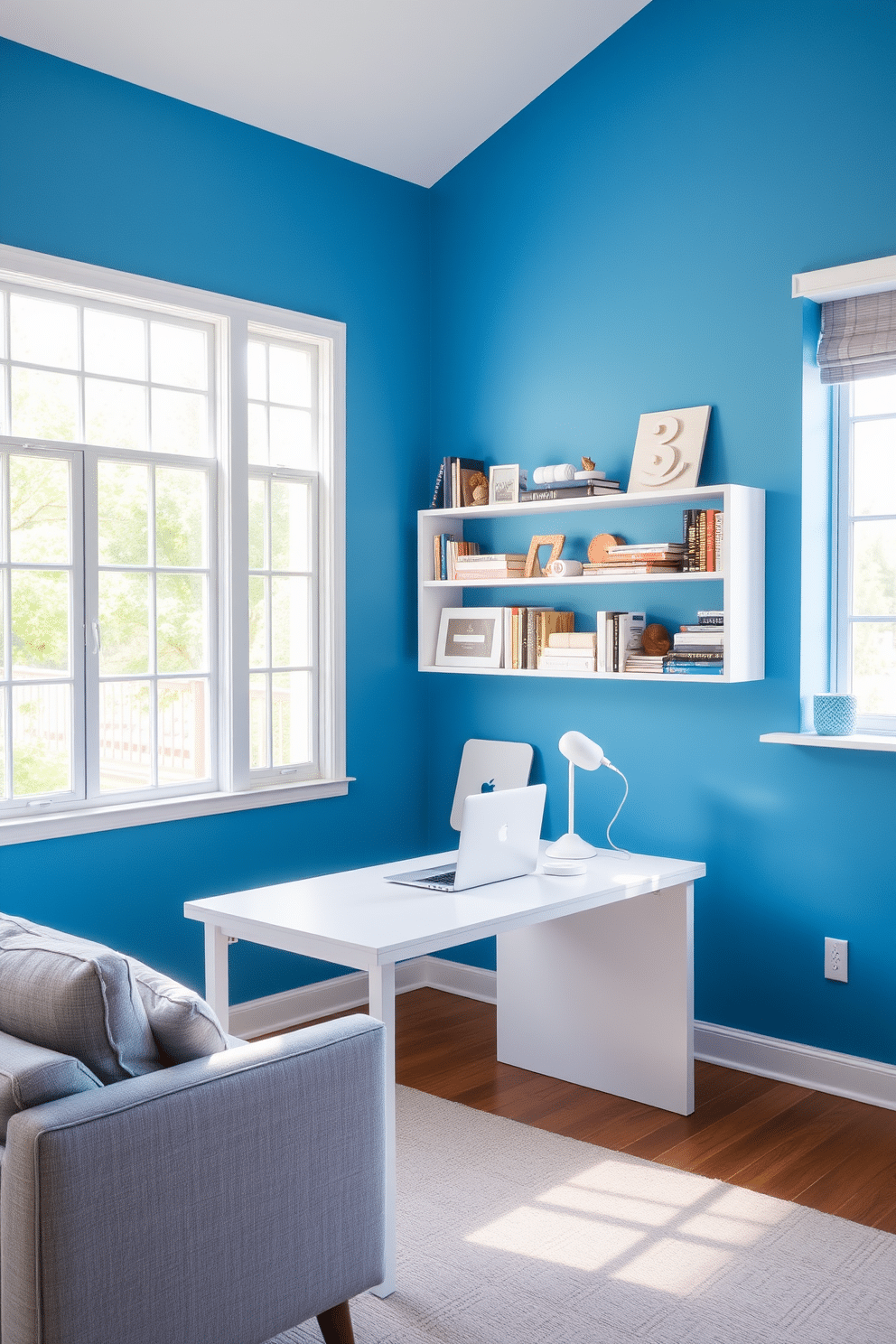 Bright accent wall with neutral furniture. The room features a vibrant blue wall that contrasts with a light gray sofa and a sleek white desk. Natural light streams in through large windows, illuminating the space. A stylish bookshelf filled with books and decorative items adds personality to the room.