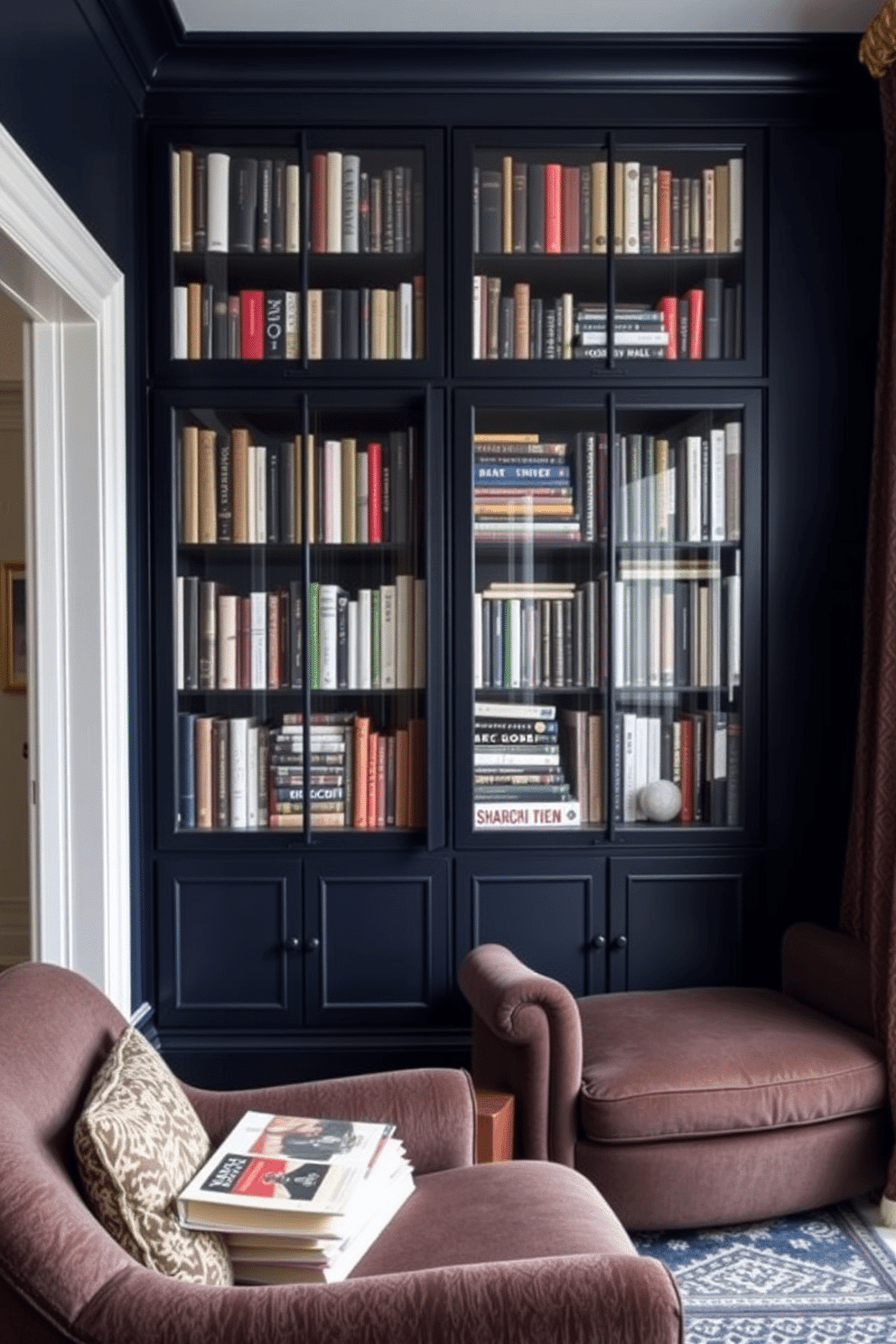 A moody home library featuring glass-front cabinets filled with an eclectic collection of books. The walls are painted in a deep navy blue, and a plush, oversized armchair sits in the corner, inviting readers to relax with their favorite novel.