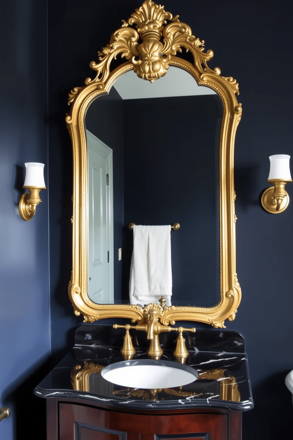 A moody powder room featuring an antique mirror with an ornate gilded frame, reflecting the soft glow of vintage sconces on either side. The walls are painted in a deep navy hue, complemented by a dark wood vanity with a marble top, adorned with elegant brass fixtures.