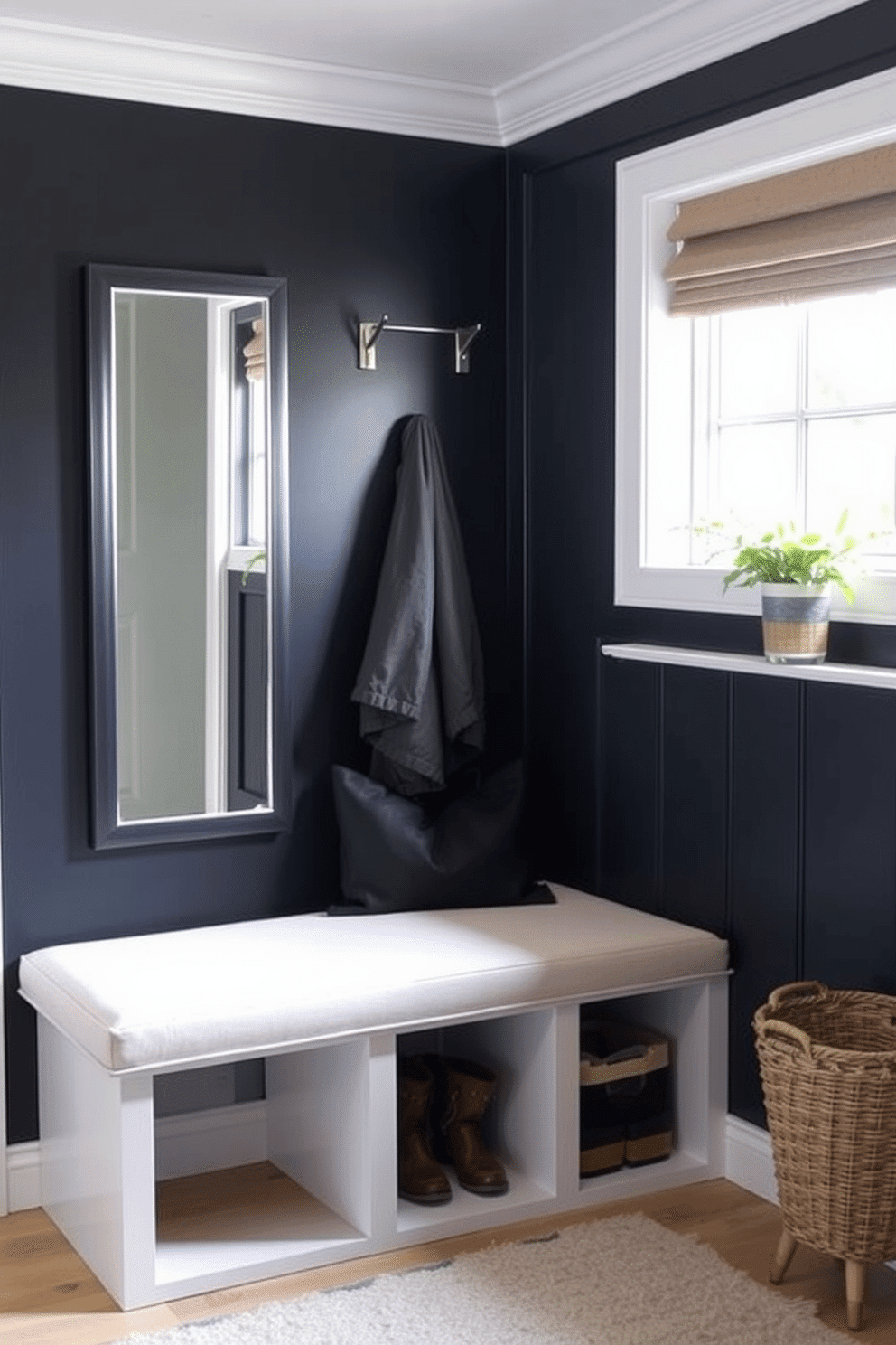 A stylish mudroom features a bench with a mirrored back that enhances the sense of space and light. The bench is upholstered in a soft, durable fabric, complemented by a sleek, modern design that invites comfort and functionality.