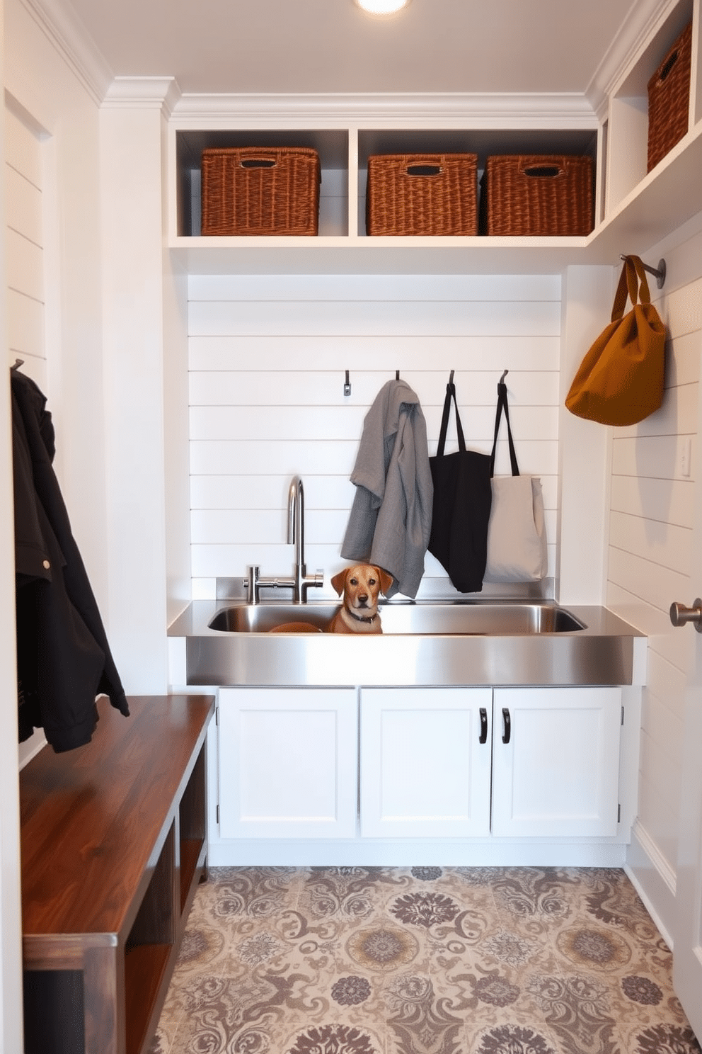 A stylish mudroom features an integrated pet washing station, complete with a stainless steel tub and a handheld showerhead. The walls are adorned with shiplap in a soft white hue, while the floor showcases durable, patterned tiles for easy cleaning. The mudroom closet design incorporates built-in shelving and cubbies for storage, along with a bench for seating. Hooks are mounted on the wall for hanging coats and bags, creating an organized and functional space.