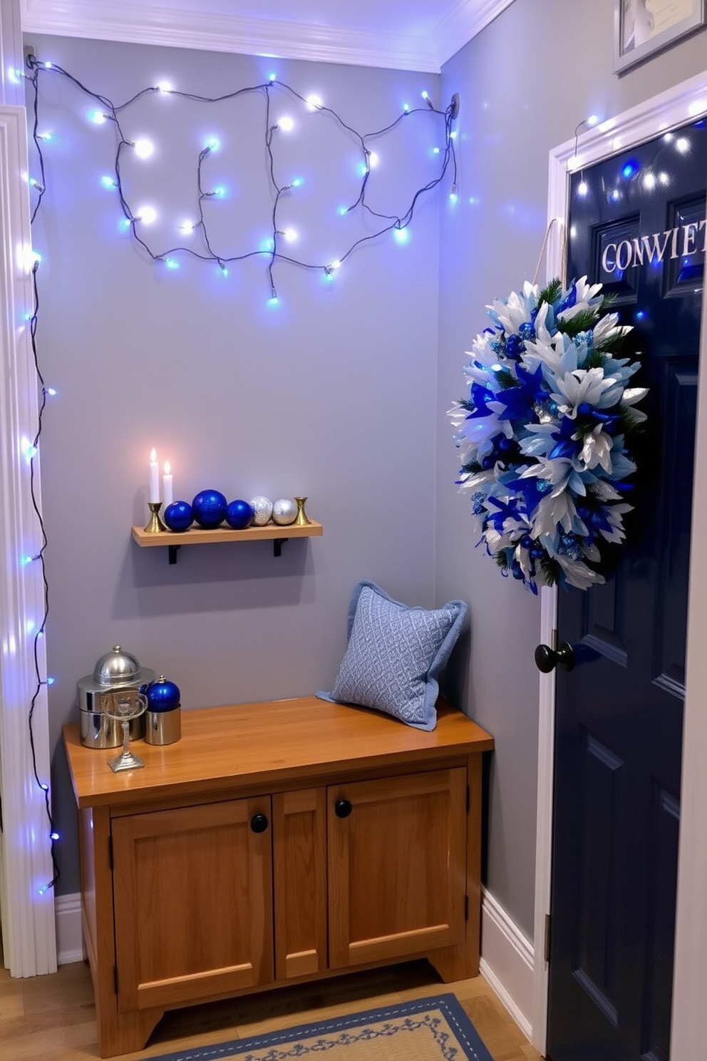 A cozy mudroom adorned with blue and silver fairy lights creates a festive atmosphere for Hanukkah celebrations. The walls are painted in a soft gray, and a wooden bench with storage underneath provides a practical yet stylish touch, while the fairy lights twinkle above, adding warmth and charm. Decorative elements include a collection of blue and silver ornaments arranged on a shelf, alongside a menorah that stands proudly on the bench. A festive wreath with blue and silver accents hangs on the door, welcoming guests with a touch of holiday spirit.