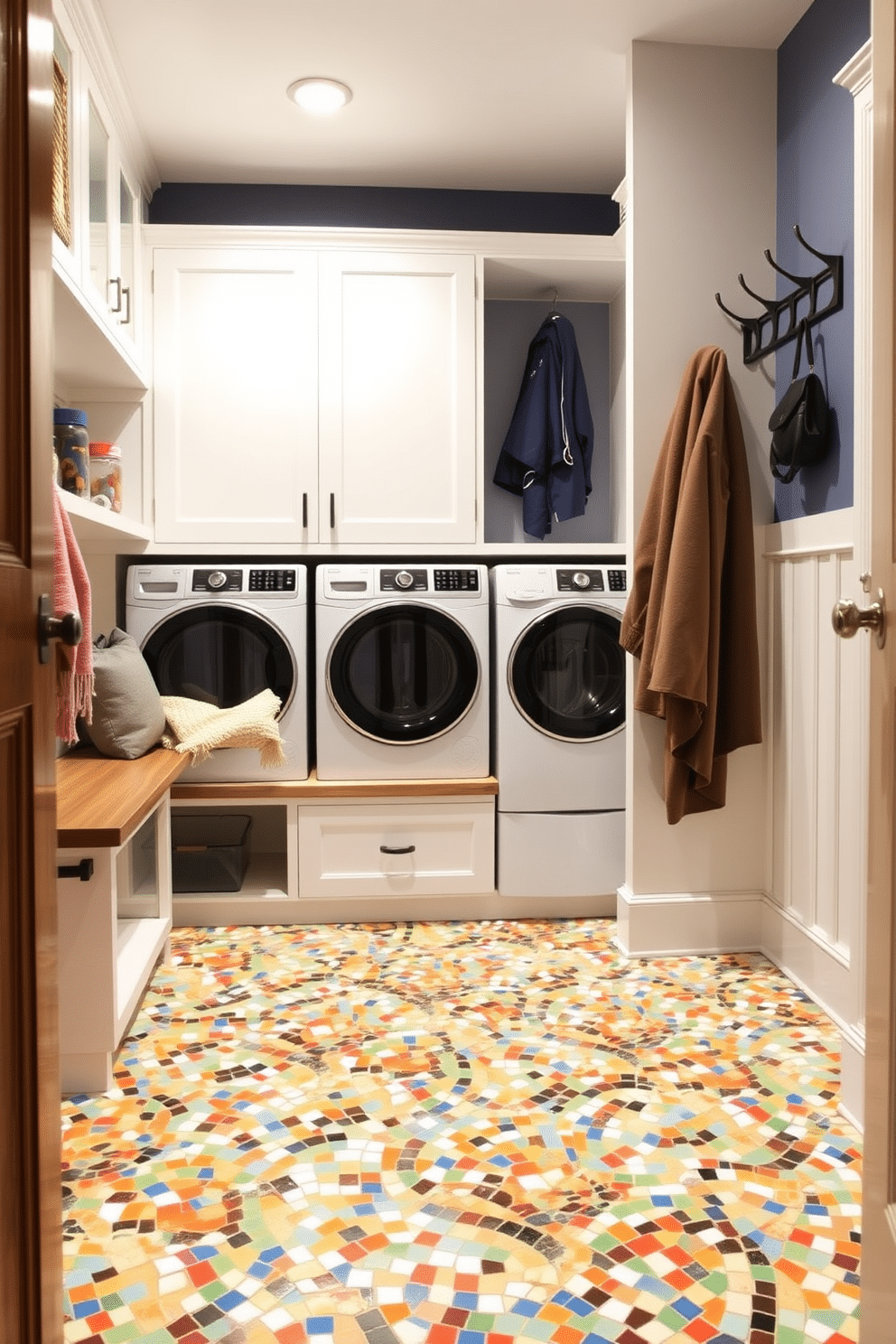 A mudroom laundry room featuring vibrant mosaic tile flooring that adds artistic flair to the space. The room includes built-in cabinetry for storage, with a stylish bench for seating and a wall-mounted coat rack for convenience.