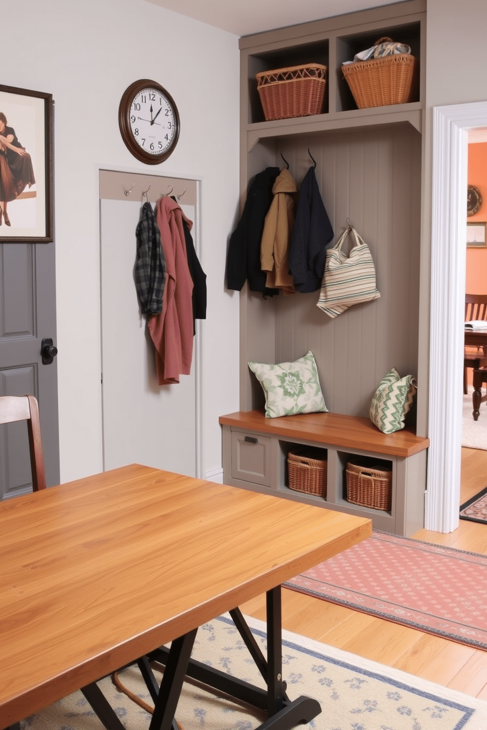 A functional folding table is designed to blend seamlessly with the surrounding decor, featuring a sleek wood finish and sturdy metal hinges. When extended, it provides ample surface area for dining or work, while its compact design allows for easy storage against the wall when not in use. The mudroom near the dining room is outfitted with built-in storage benches and hooks for coats, creating an organized and welcoming entryway. The space is accented with a cheerful color palette, incorporating a patterned rug and decorative baskets for added warmth and functionality.