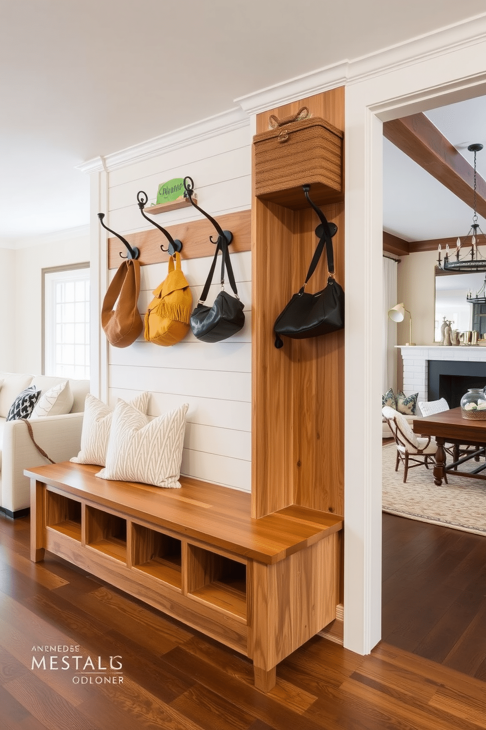 A stylish mudroom adjacent to the family room features a built-in bench with plush cushions and hooks for coats and bags mounted on the wall. The space is adorned with a combination of warm wood tones and white shiplap, creating a cozy and inviting atmosphere.