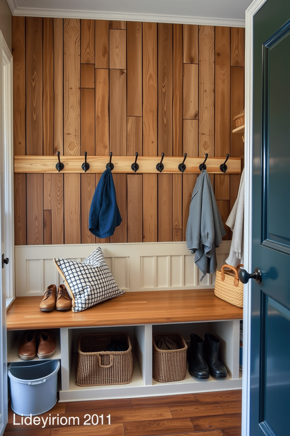 A charming mudroom featuring vintage hooks mounted on a rustic wooden wall, adding character and functionality. The space is designed with a cozy bench for seating, surrounded by storage for shoes and outdoor gear, creating a welcoming transition from the outdoors to the family room.