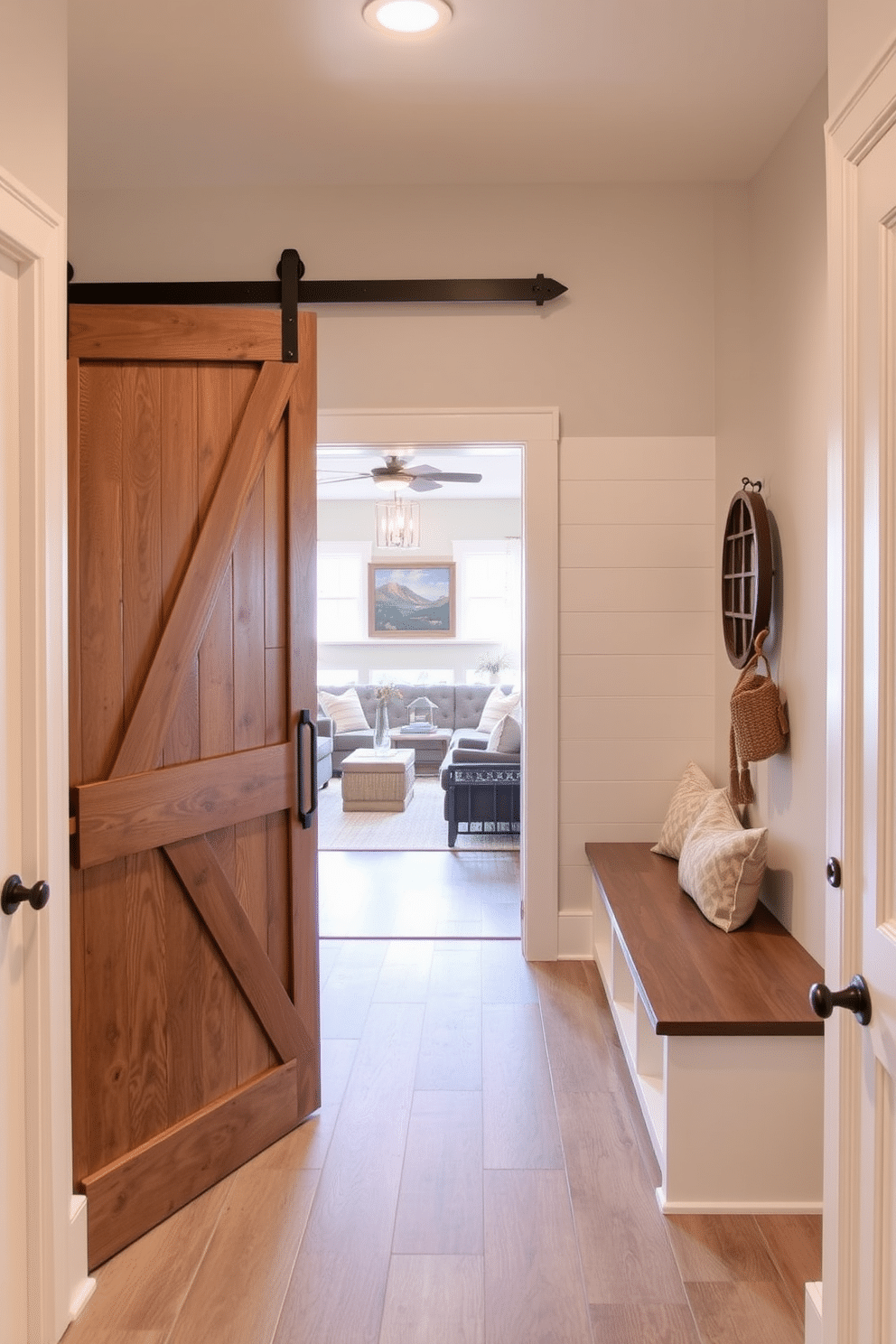 A welcoming mudroom features a sliding barn door entrance that adds rustic charm. Inside, built-in benches with storage cubbies provide functionality, while a shiplap accent wall enhances the cozy atmosphere. Adjacent to the family room, the mudroom seamlessly blends style and practicality. Soft, neutral tones and durable flooring create an inviting space, perfect for managing daily activities and keeping the home organized.