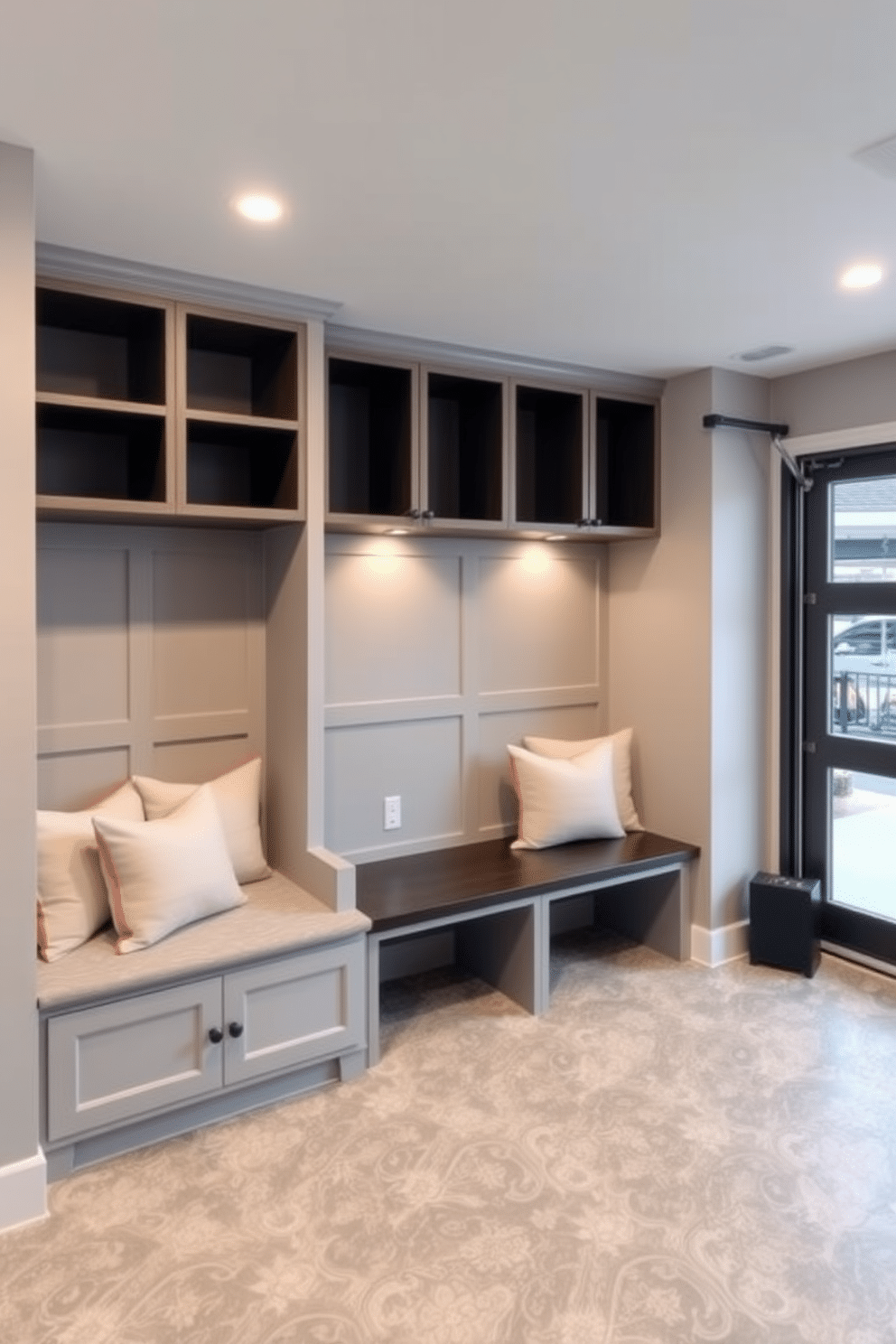 A stylish mudroom adjacent to the garage features built-in benches with plush cushions and storage cubbies above. The walls are painted a soft gray, complemented by a durable, patterned tile floor that can withstand heavy foot traffic. Recessed lighting is strategically placed in the ceiling to create a bright and inviting ambiance throughout the space. The warm glow enhances the mudroom's functionality, illuminating the organized storage and making it a welcoming area for family and guests.