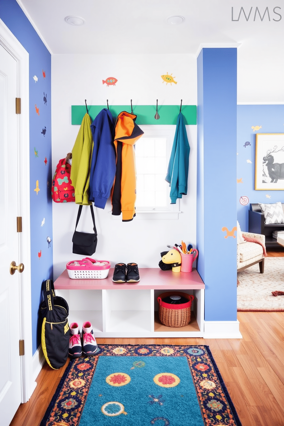 A vibrant mudroom designed for children, featuring colorful hooks at varying heights for easy access to jackets. The space is brightened with playful wall decals and a cheerful rug, creating an inviting transition area near the living room.