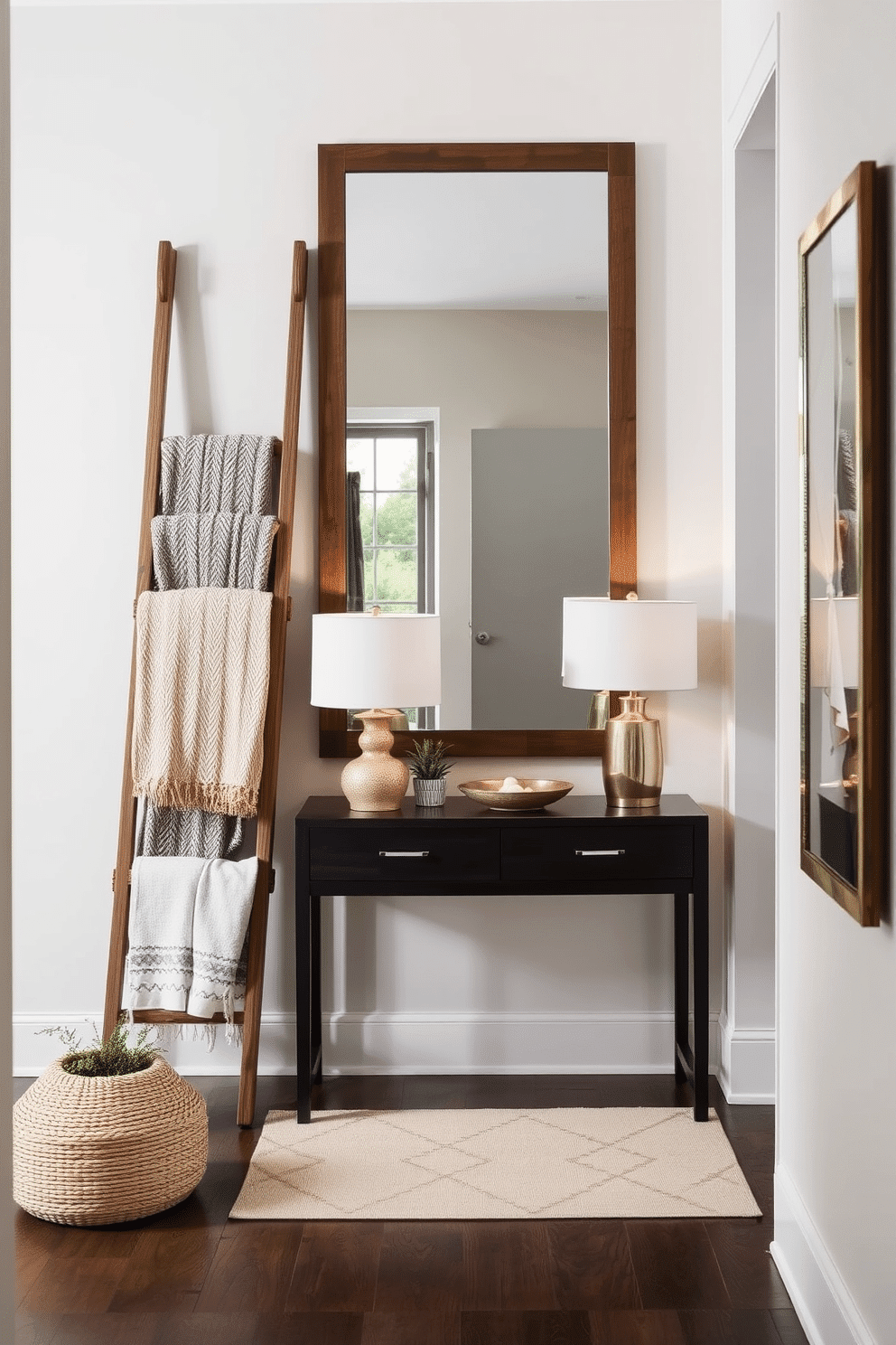 A decorative ladder is positioned against the wall, showcasing a collection of cozy blankets in various textures and colors. The ladder is crafted from reclaimed wood, adding a rustic charm to the space, while a small potted plant sits at its base, bringing a touch of greenery. The narrow entryway features a sleek console table made of dark wood, topped with a stylish lamp and a decorative bowl for keys. A large mirror hangs above the table, creating an illusion of space, while a soft rug in muted tones adds warmth underfoot.