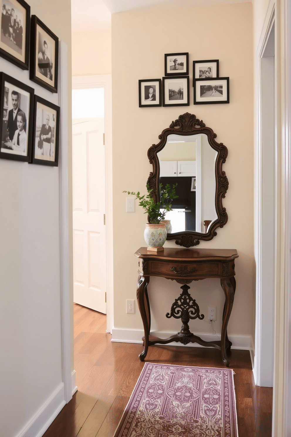 A narrow foyer adorned with vintage finds creates a unique and inviting atmosphere. An antique console table with intricate detailing sits against the wall, topped with a vintage mirror that reflects light beautifully. On the floor, a patterned runner adds warmth and character, while a collection of framed black-and-white photographs hangs above the table. A small potted plant in a decorative ceramic pot brings a touch of greenery to the space, enhancing the overall charm.