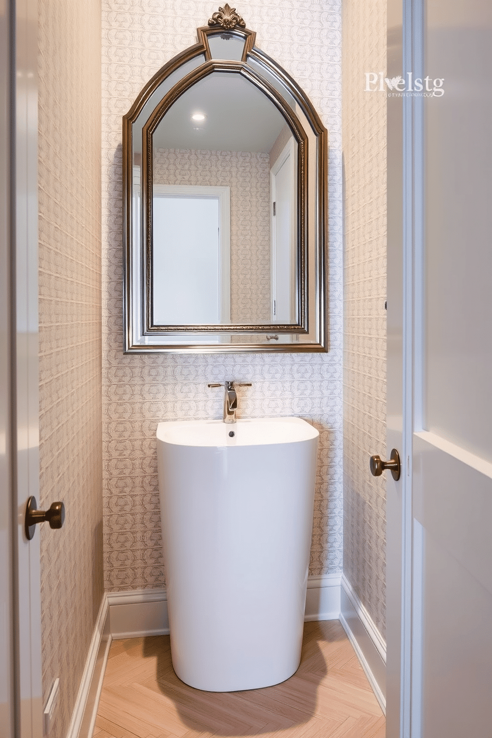 A narrow powder room featuring a striking statement mirror that serves as the focal point above a sleek, modern sink. The walls are adorned with elegant wallpaper in a subtle pattern, while the flooring showcases a chic herringbone design in light wood tones.