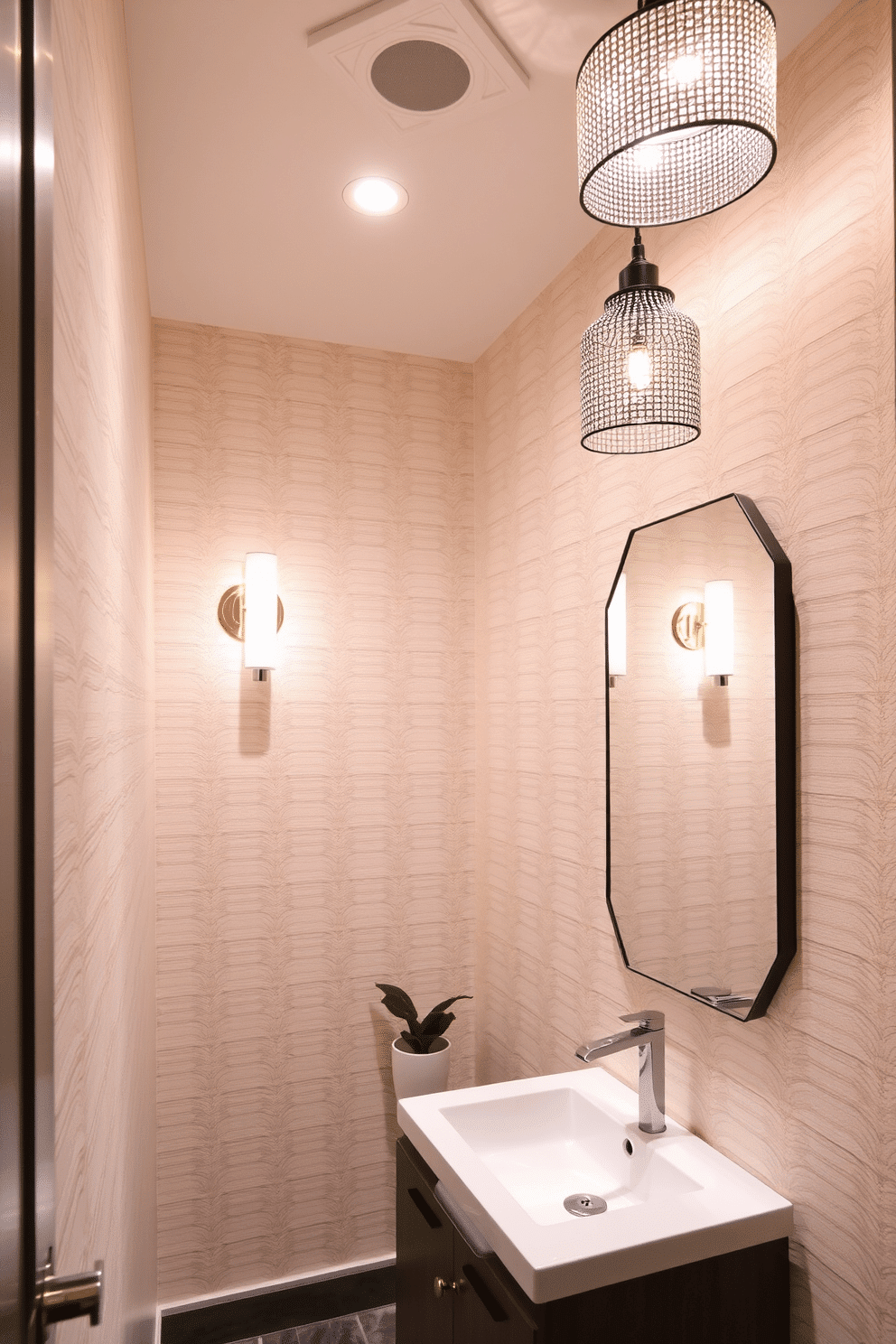 A narrow powder room features layered lighting that creates a warm and inviting ambiance. The space is illuminated with a combination of recessed ceiling lights, a stylish wall sconce above the mirror, and a decorative pendant light that hangs gracefully from the ceiling. The walls are adorned with a soft, neutral wallpaper that adds texture without overwhelming the space. A sleek, modern vanity with a vessel sink sits against one wall, complemented by a minimalist mirror that reflects the carefully curated decor, including a small potted plant and elegant hand towels.