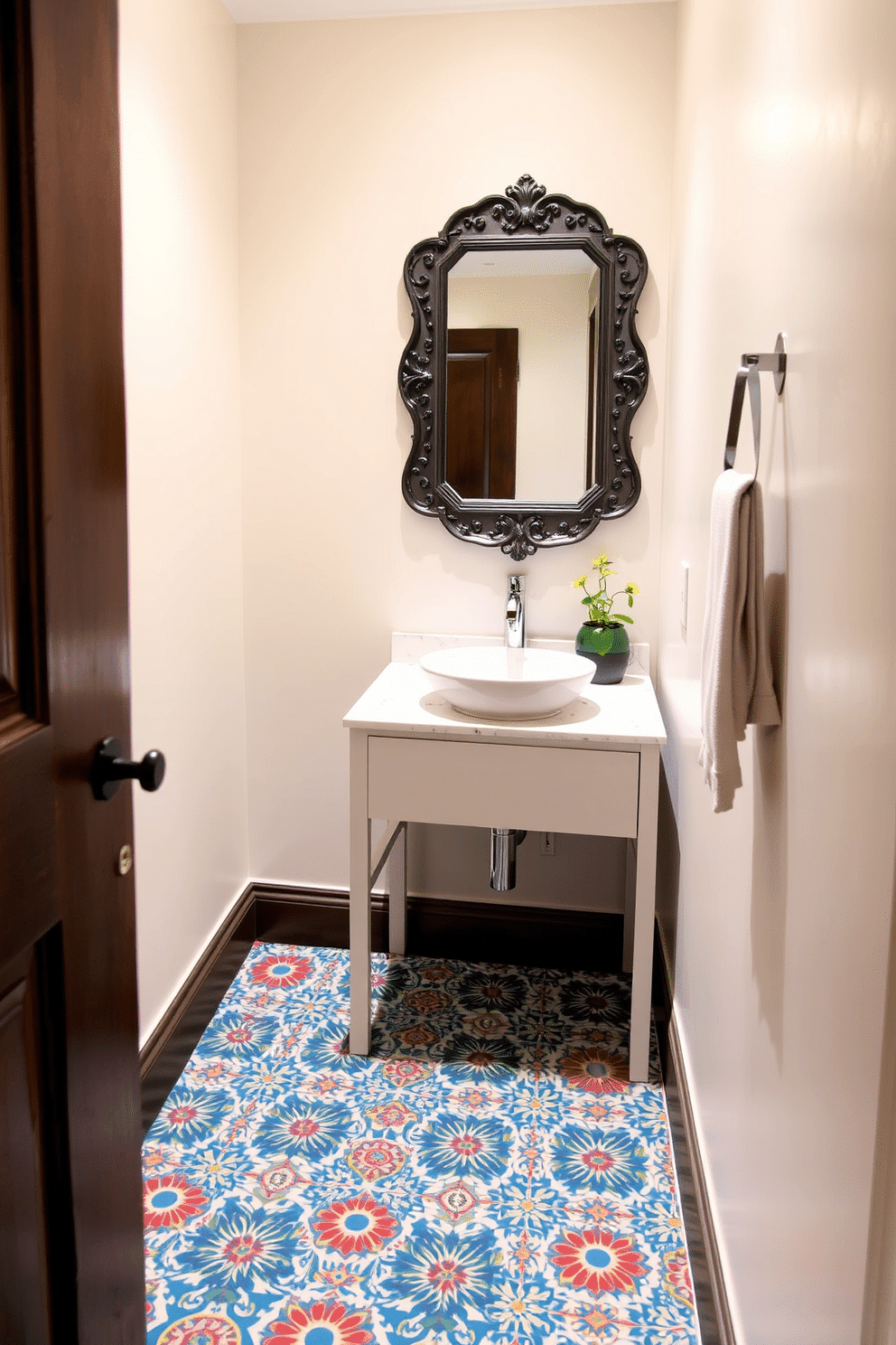 A narrow powder room features a striking floor adorned with decorative tiles in vibrant geometric patterns, creating a captivating focal point. The walls are painted in a soft, neutral tone, enhancing the sense of space while complementing the intricate tile work. A sleek, modern vanity with a vessel sink sits against one wall, topped with a polished quartz countertop. Above the vanity, a stylish mirror with an ornate frame reflects the room's unique design elements, while a small potted plant adds a touch of greenery to the space.