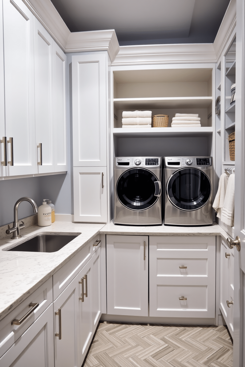 A stylish laundry room features a spacious countertop designed for sorting clothes, made of durable quartz with a subtle veining pattern. The cabinetry is a soft white with brushed nickel hardware, providing ample storage for laundry essentials and cleaning supplies. In the corner, a modern washing machine and dryer are stacked for efficiency, framed by open shelving that displays neatly folded towels and decorative baskets. The walls are painted in a calming light blue, while the floor is covered with a chic, water-resistant vinyl in a herringbone pattern.