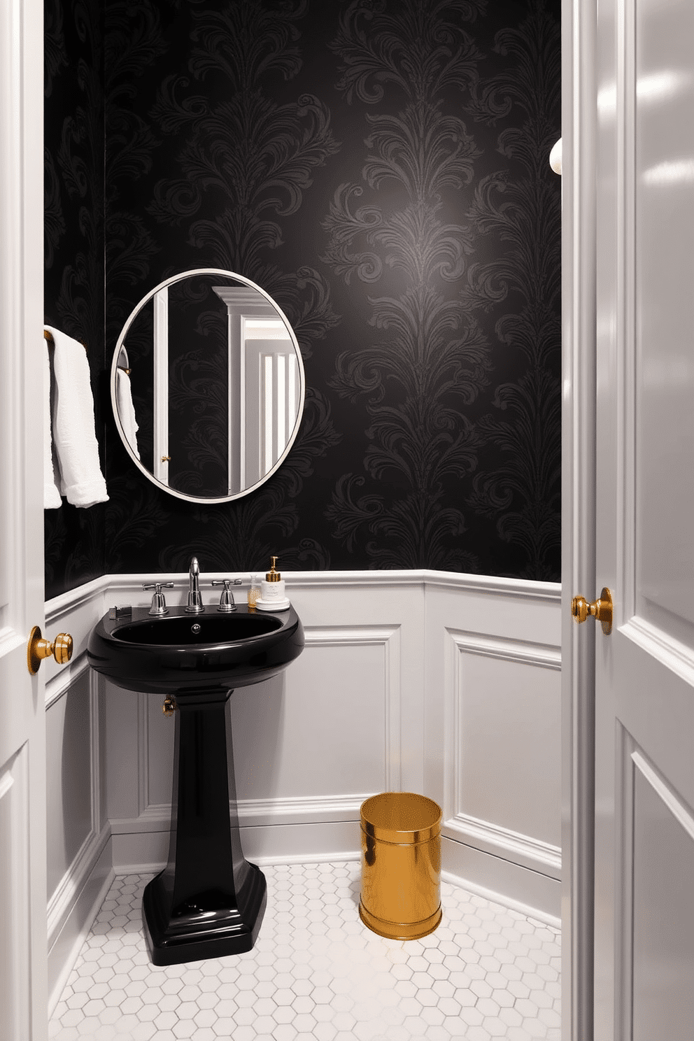 A chic powder room featuring a striking black and white color scheme. The walls are adorned with elegant black wallpaper, while the floor is covered in classic white hexagonal tiles. A sleek black pedestal sink sits against the wall, complemented by a large round mirror with a thin white frame. Accents of gold are introduced through stylish fixtures and a decorative wall sconce, adding a touch of luxury to the space.