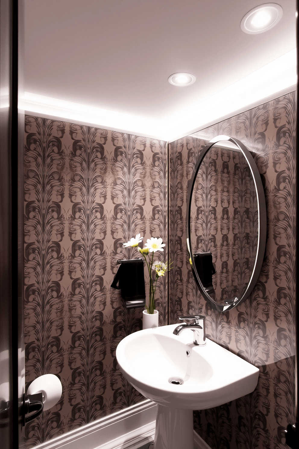 A chic powder room featuring recessed lighting that creates a sleek and modern ambiance. The walls are adorned with elegant wallpaper, and a stylish mirror reflects the soft glow from the recessed fixtures above.