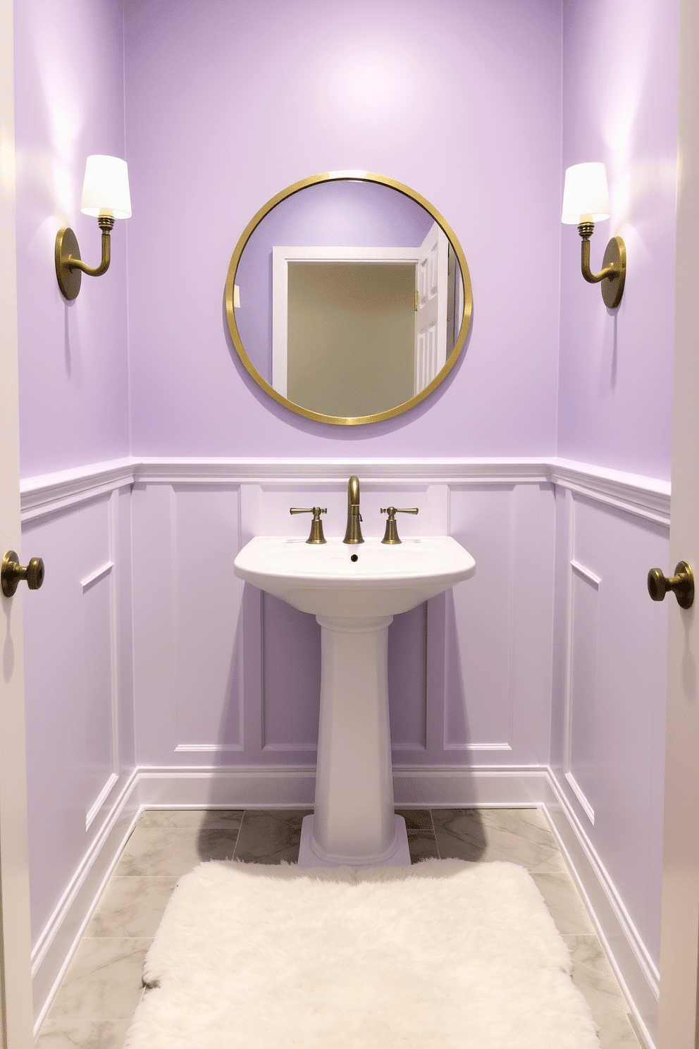 A serene powder room painted in a dusty lavender hue creates a calming atmosphere. The walls are adorned with delicate white wainscoting, and a sleek, modern pedestal sink complements the soft color. A round mirror with a brushed gold frame hangs above the sink, reflecting the gentle light from a stylish sconce on either side. The flooring features light gray tiles, adding a subtle contrast to the lavender walls, while a plush white rug offers comfort underfoot.