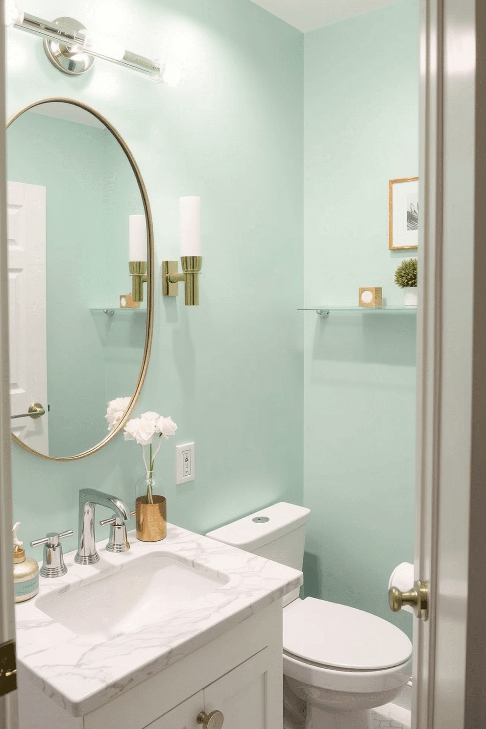 A stylish powder room featuring cool mint green walls that create a refreshing and airy atmosphere. The space is accented with sleek white fixtures and a chic marble vanity, complemented by decorative elements in soft gold tones.