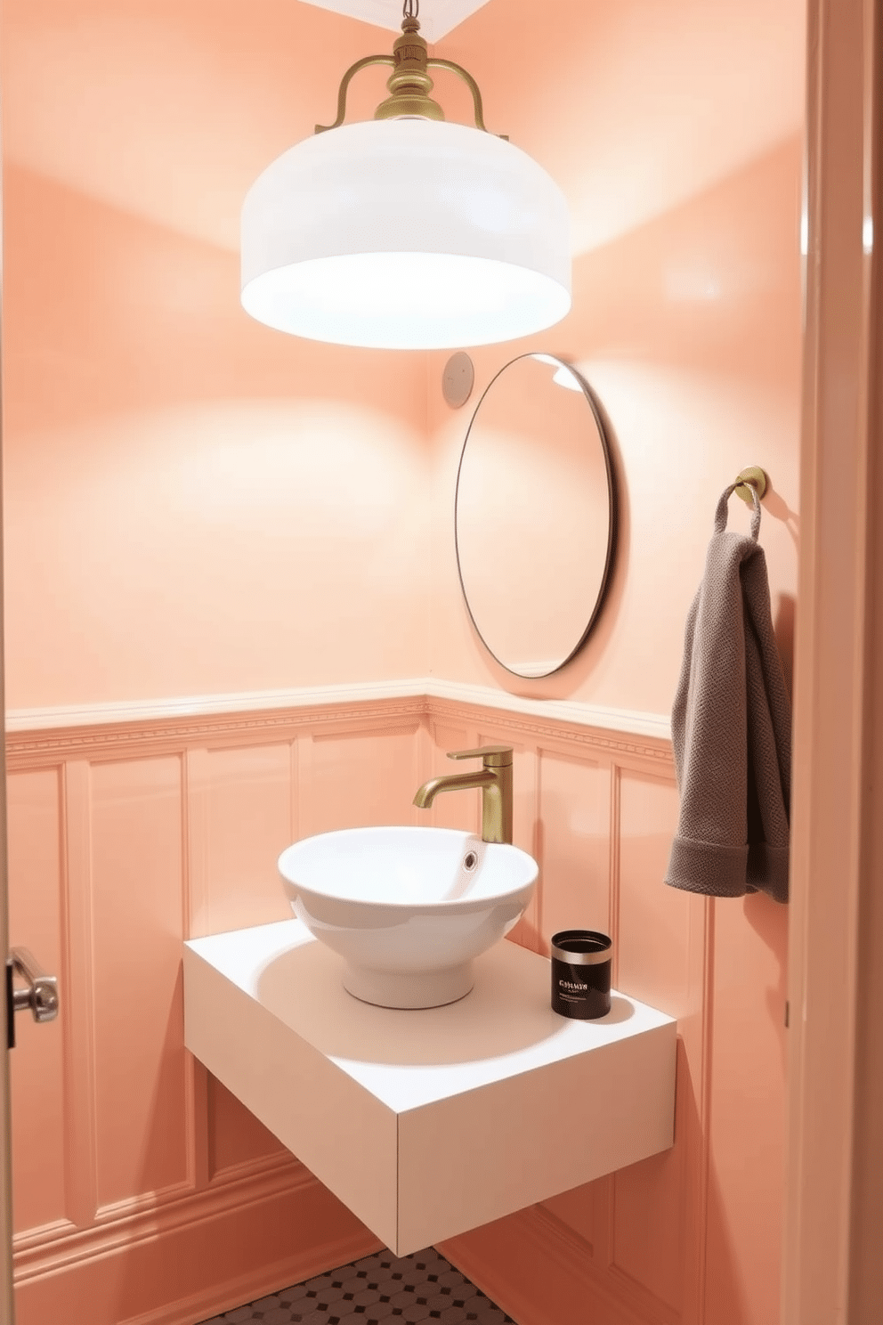 A chic powder room painted in a soft peach hue creates a warm and inviting atmosphere. The walls are adorned with delicate wainscoting, complementing the warm glow of the paint. A sleek, modern sink with a brushed gold faucet sits atop a minimalist floating vanity. The space is illuminated by a stylish pendant light that adds a touch of elegance and enhances the peach tones.