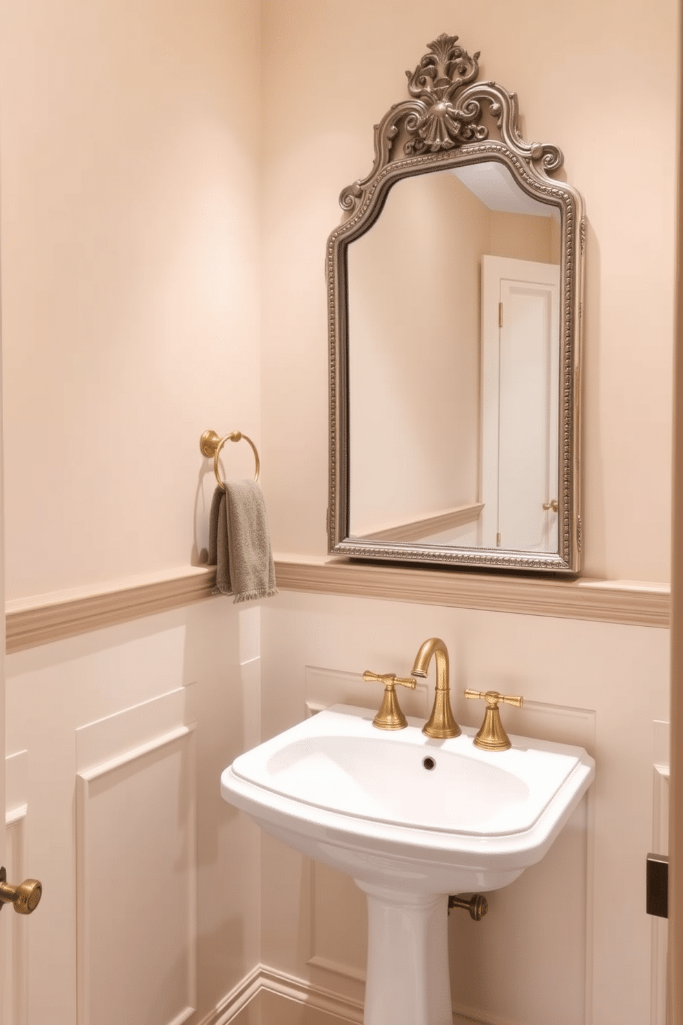 A powder room featuring creamy beige walls that exude timeless appeal, complemented by elegant wainscoting in a slightly lighter shade. The space is adorned with a vintage-style mirror above a sleek, modern sink, while gold accents in the fixtures add a touch of luxury.