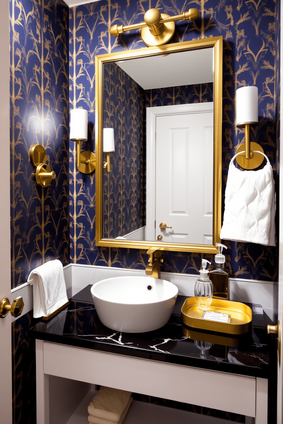 A chic powder room featuring a statement wallpaper with a bold geometric pattern in deep navy and gold. The walls are adorned with metallic accents, including a sleek gold-framed mirror and brushed brass fixtures, creating an elegant contrast. The vanity is a modern piece with a glossy white finish, topped with a striking black marble countertop. To enhance the glamour, decorative elements like a crystal soap dispenser and a stylish gold tray are placed on the countertop, completing the luxurious look.