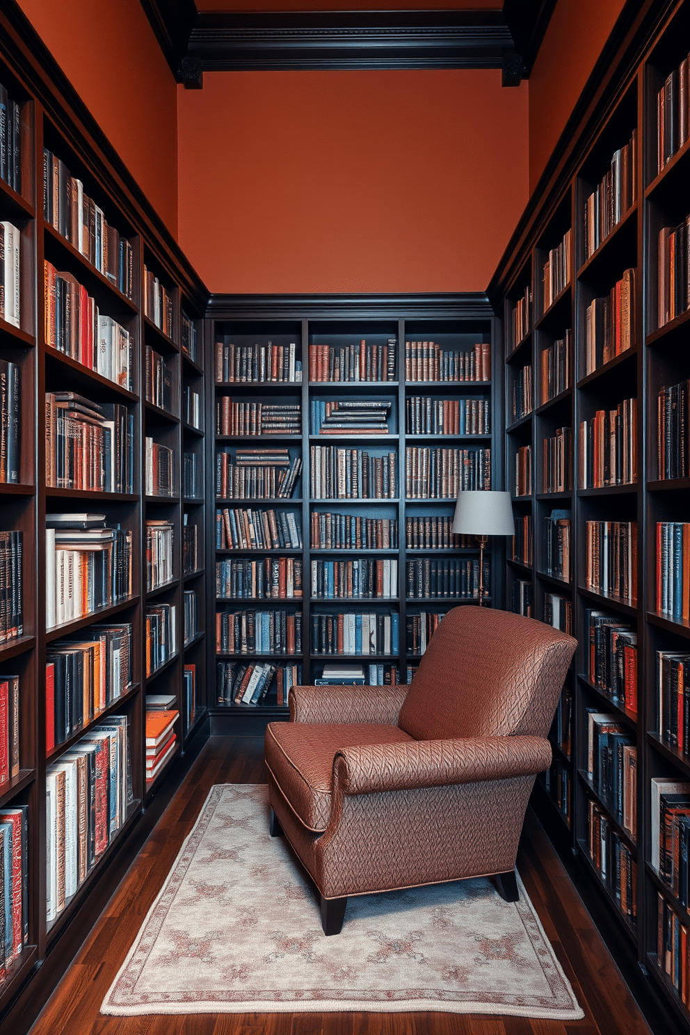 A cozy reading room features dark wood shelves that stretch from floor to ceiling, showcasing an extensive collection of books. A plush armchair with a rich, textured fabric sits in the corner, inviting readers to settle in with a good novel. The walls are painted in a warm, inviting hue, complementing the deep tones of the wood. A soft area rug lies beneath the armchair, adding a touch of comfort to the space.