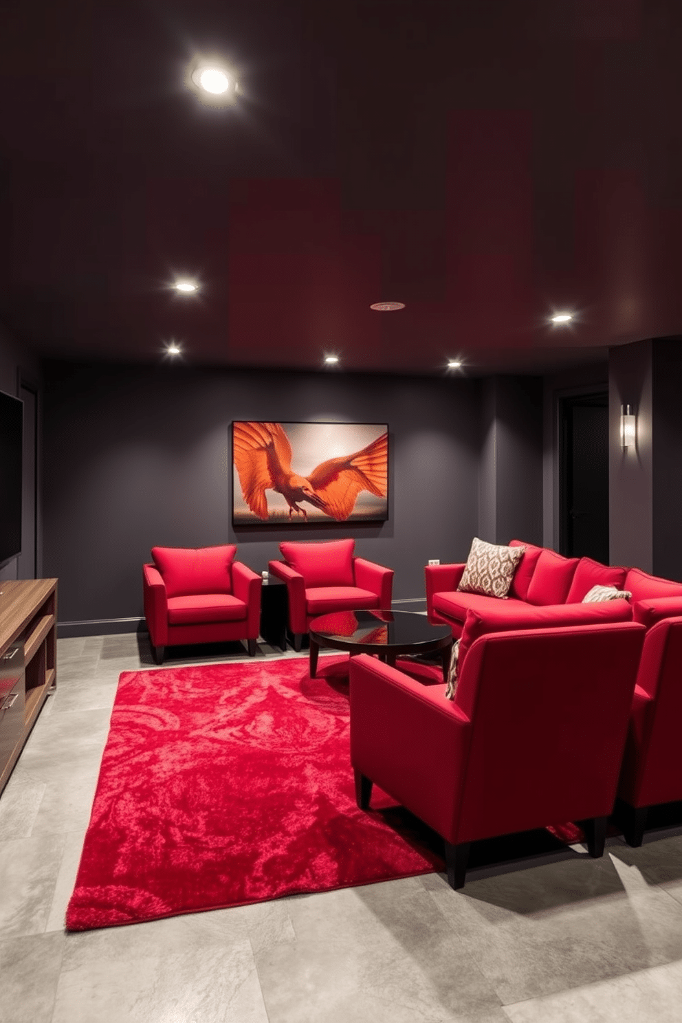 A modern basement design that combines deep red and sleek gray elements for a sophisticated atmosphere. The walls are painted in a rich gray, accented by bold red furniture, including a plush sectional sofa and contemporary armchairs. The flooring features polished concrete with a warm gray tone, complemented by a striking red area rug that adds a pop of color. Ambient lighting fixtures in brushed nickel highlight the space, creating an inviting yet elegant environment for relaxation and entertainment.