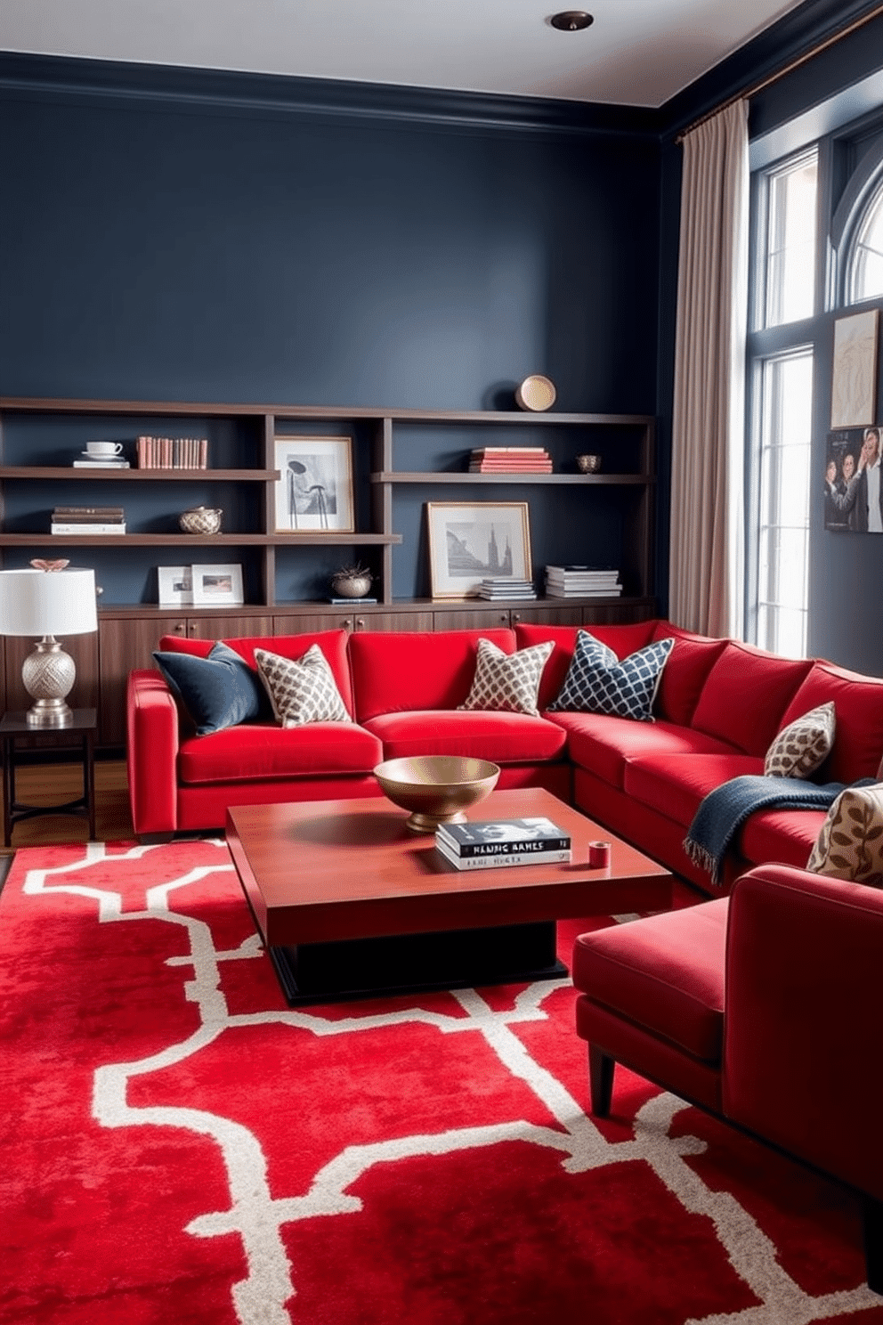 A sophisticated family room that combines rich red and deep navy tones. The walls are painted a soft navy, while a plush red sectional sofa anchors the space, complemented by navy and white patterned throw pillows. A large area rug with a geometric design in red and navy ties the room together. Elegant wooden shelves display curated decor items, and a modern coffee table sits at the center, adorned with a few art books and a decorative bowl.