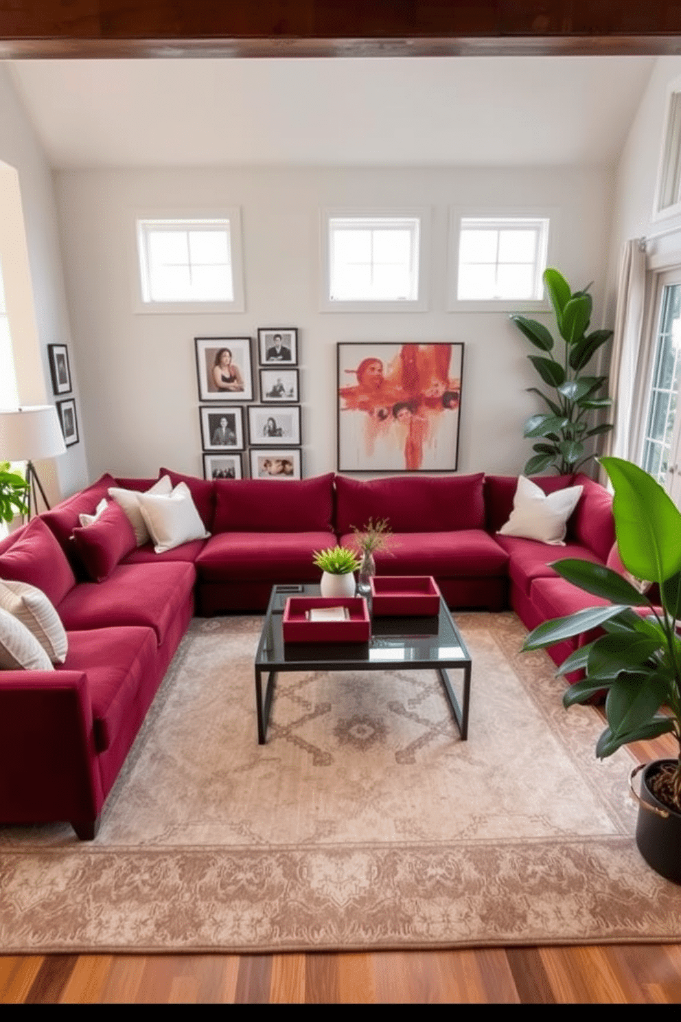 A cozy family room featuring a plush sectional sofa in a rich burgundy hue, complemented by soft cream throw pillows. A large area rug with a subtle geometric pattern anchors the seating area, while a sleek coffee table sits at the center, adorned with red decorative trays for organization. On the walls, a gallery of family photos in elegant frames creates a personal touch, while a statement piece of abstract art adds a pop of color. Large windows allow natural light to flood the space, and lush green plants are strategically placed to enhance the inviting atmosphere.