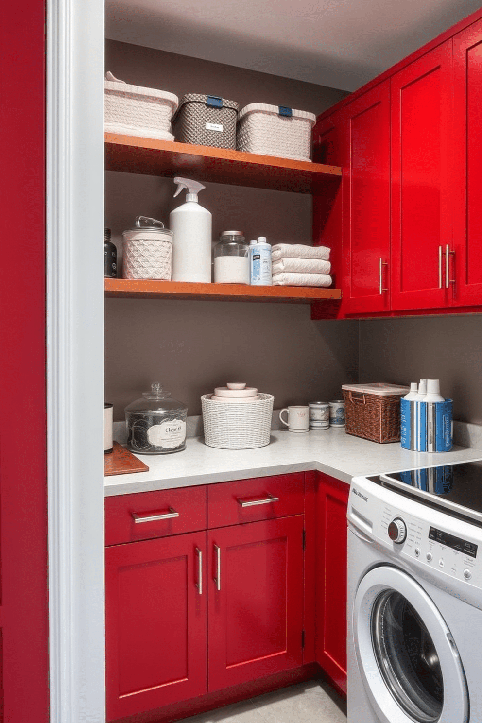 A contemporary laundry room features striking red cabinetry that provides ample storage while adding a bold pop of color to the space. Open shelves above the countertop display neatly arranged laundry essentials, creating an inviting and functional atmosphere.