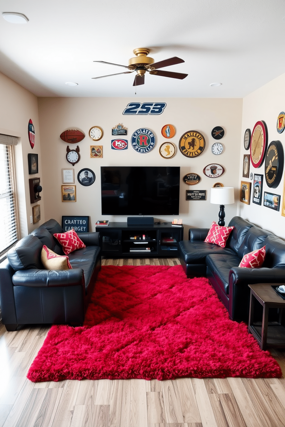 A cozy man cave featuring a plush red area rug that defines the seating area, surrounded by a sectional sofa in dark leather. The walls are adorned with vintage sports memorabilia, and a large flat-screen TV is mounted above a sleek black media console.