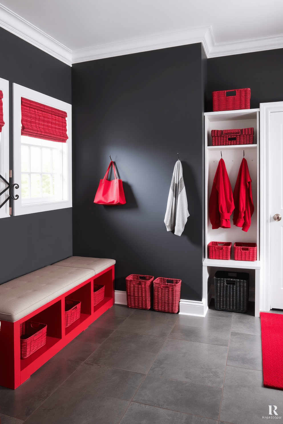 A modern mudroom featuring a striking red and gray color scheme. The walls are painted a deep charcoal gray, while vibrant red accents are incorporated through storage cubbies and a bench with plush cushions. The flooring consists of large gray tiles with a subtle texture, providing both style and durability. A stylish coat rack in a sleek design complements the overall aesthetic, while decorative baskets in varying shades of red add organization and warmth.