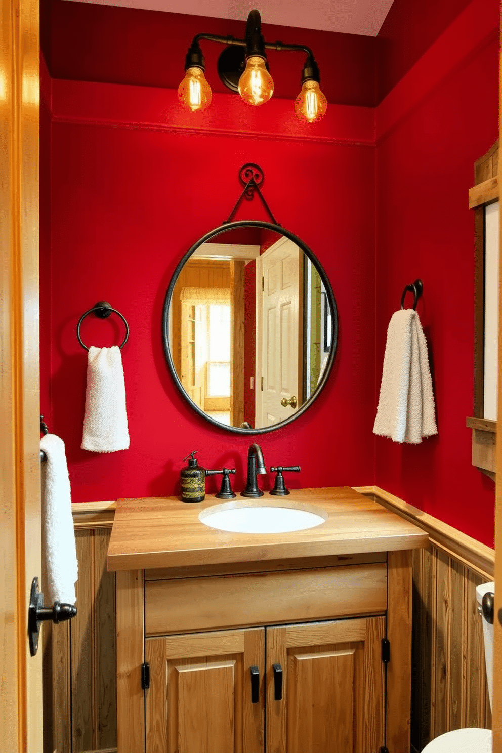 A charming powder room featuring rustic red accents that complement the natural wood elements throughout the space. The walls are adorned with warm, deep red paint, while a reclaimed wood vanity with a distressed finish adds character and warmth. A round mirror with a wrought iron frame hangs above the vanity, reflecting the cozy ambiance. Rustic light fixtures with Edison bulbs illuminate the room, creating a welcoming atmosphere perfect for guests.