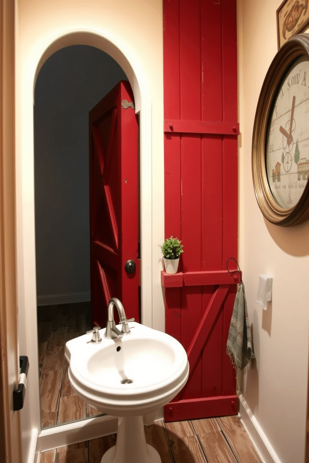 A rustic red barn door adds a touch of charm to the powder room, creating a warm and inviting atmosphere. The walls are painted in a soft cream color, while the floor features distressed wooden planks that enhance the rustic aesthetic. The powder room includes a vintage pedestal sink with a brushed nickel faucet, complemented by a round mirror with a weathered frame. Decorative elements like a small potted plant and rustic wall art complete the cozy, farmhouse-inspired design.