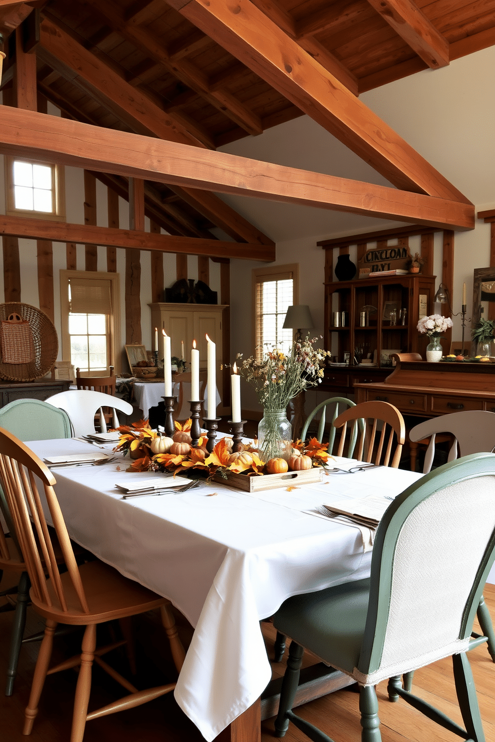 A beautifully set dining table adorned with seasonal decorations. The table features a crisp white tablecloth, with an arrangement of autumn leaves, small pumpkins, and candles in varied heights, creating a warm and inviting atmosphere. A rustic dining room with exposed wooden beams and a large farmhouse table. Surrounding the table are mismatched chairs, and the space is accented with vintage decor, including a woven basket and a centerpiece of wildflowers in a mason jar.