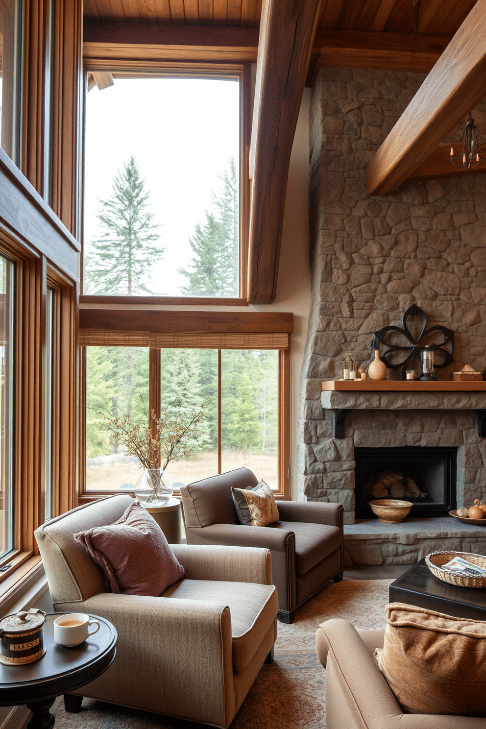 Cozy reading nook by the window. A plush armchair upholstered in soft fabric is positioned next to a large window, with a small side table holding a steaming cup of tea. Rustic family room design ideas. Exposed wooden beams stretch across the ceiling, while a stone fireplace serves as the focal point, surrounded by comfortable seating and warm, earthy tones.